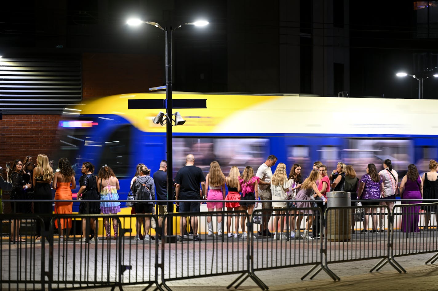 Concert goers wait for the next light rail train after a Taylor Swift concert Friday, June 23, 2023, outside US Bank Stadium in Minneapolis.