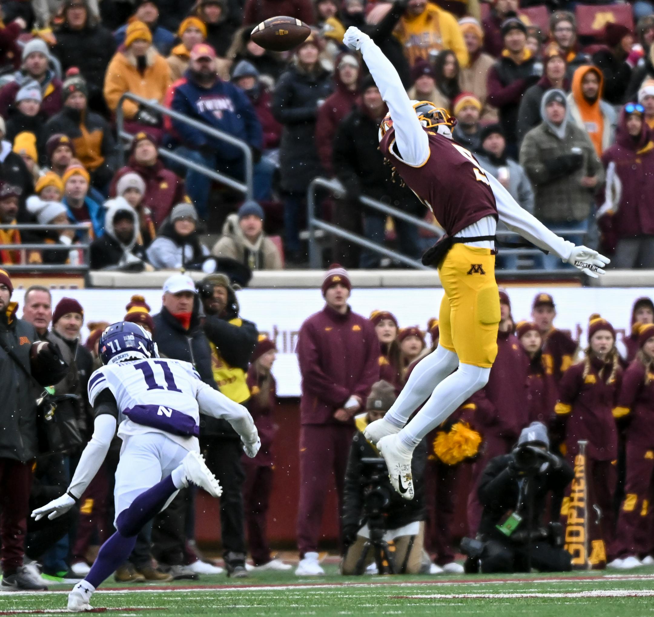 Minnesota Gophers wide receiver Dylan Wright (5) misses a pass from quarterback Athan Kaliakmanis (8) during the first half.