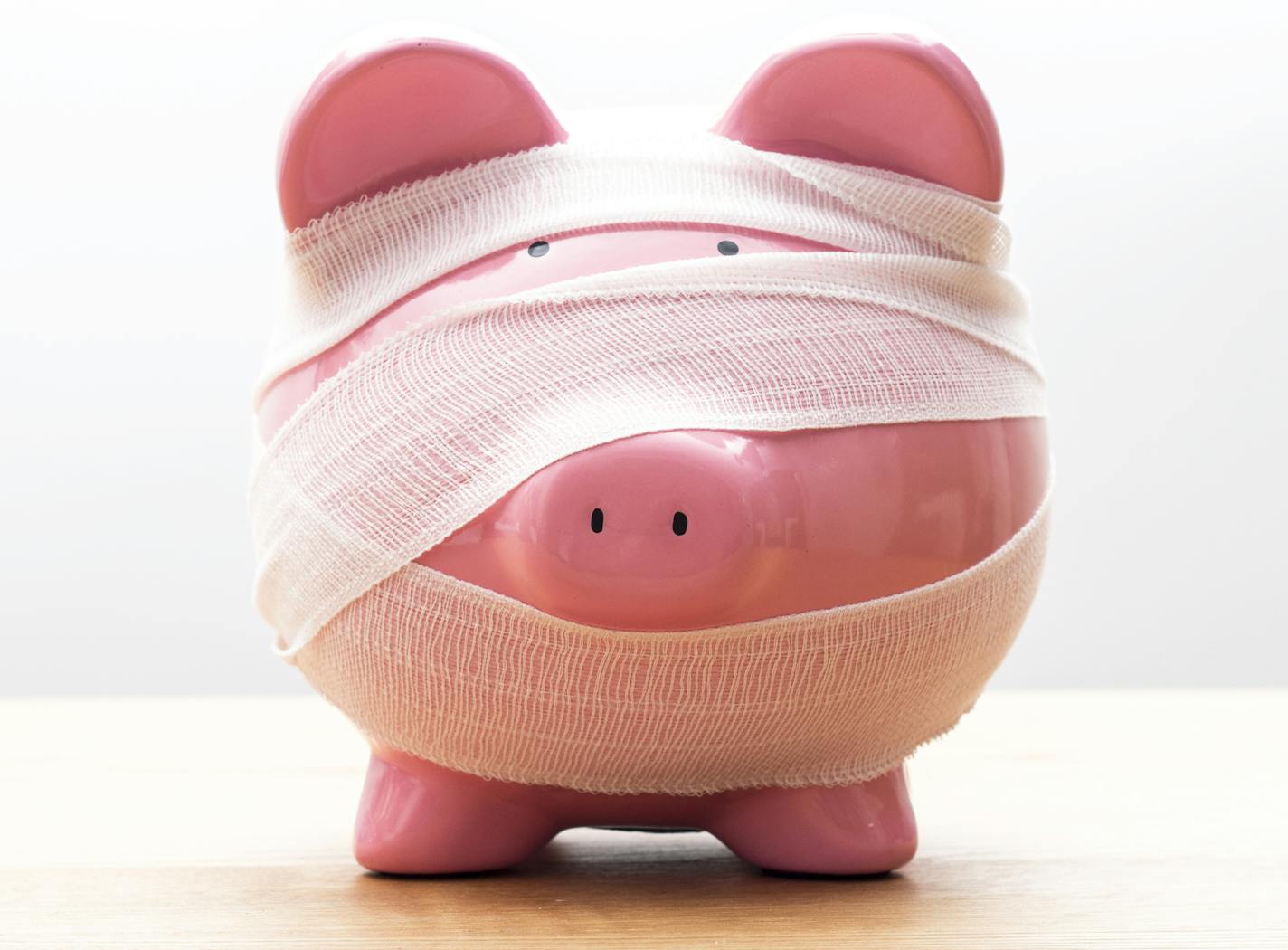 Piggy bank with bandages.