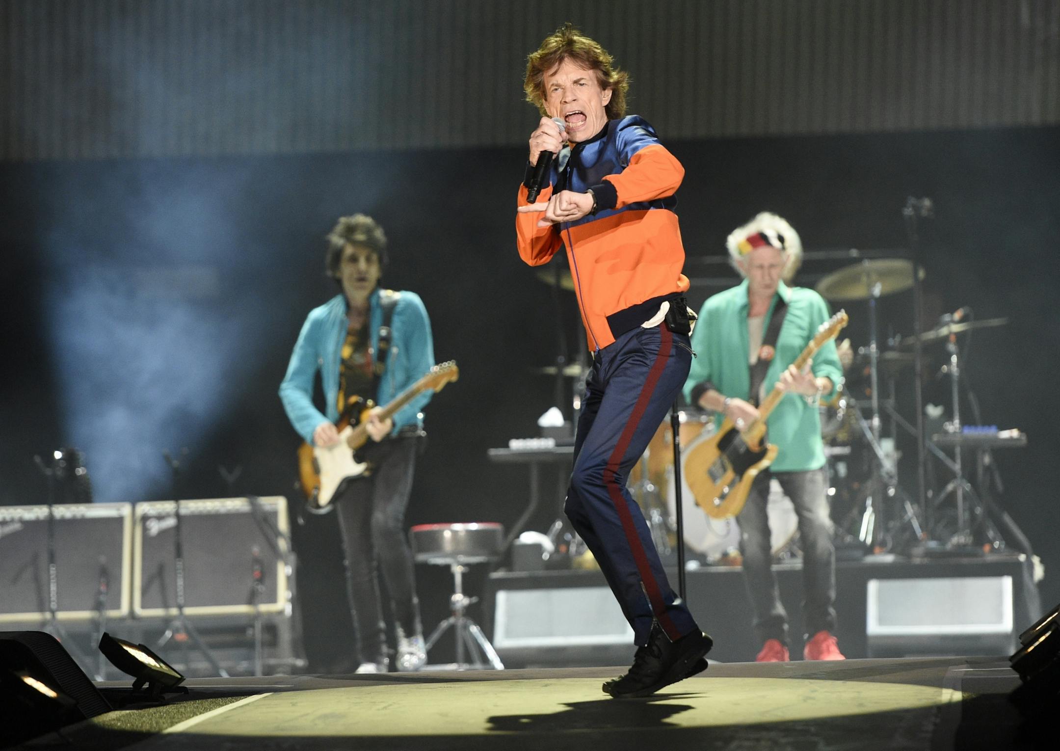 Mick Jagger, center, performs with Ron Wood, left, and Keith Richards of the Rolling Stones during their performance on day 1 of the 2016 Desert Trip music festival at Empire Polo Field on Friday, Oct. 7, 2016, in Indio, Calif.