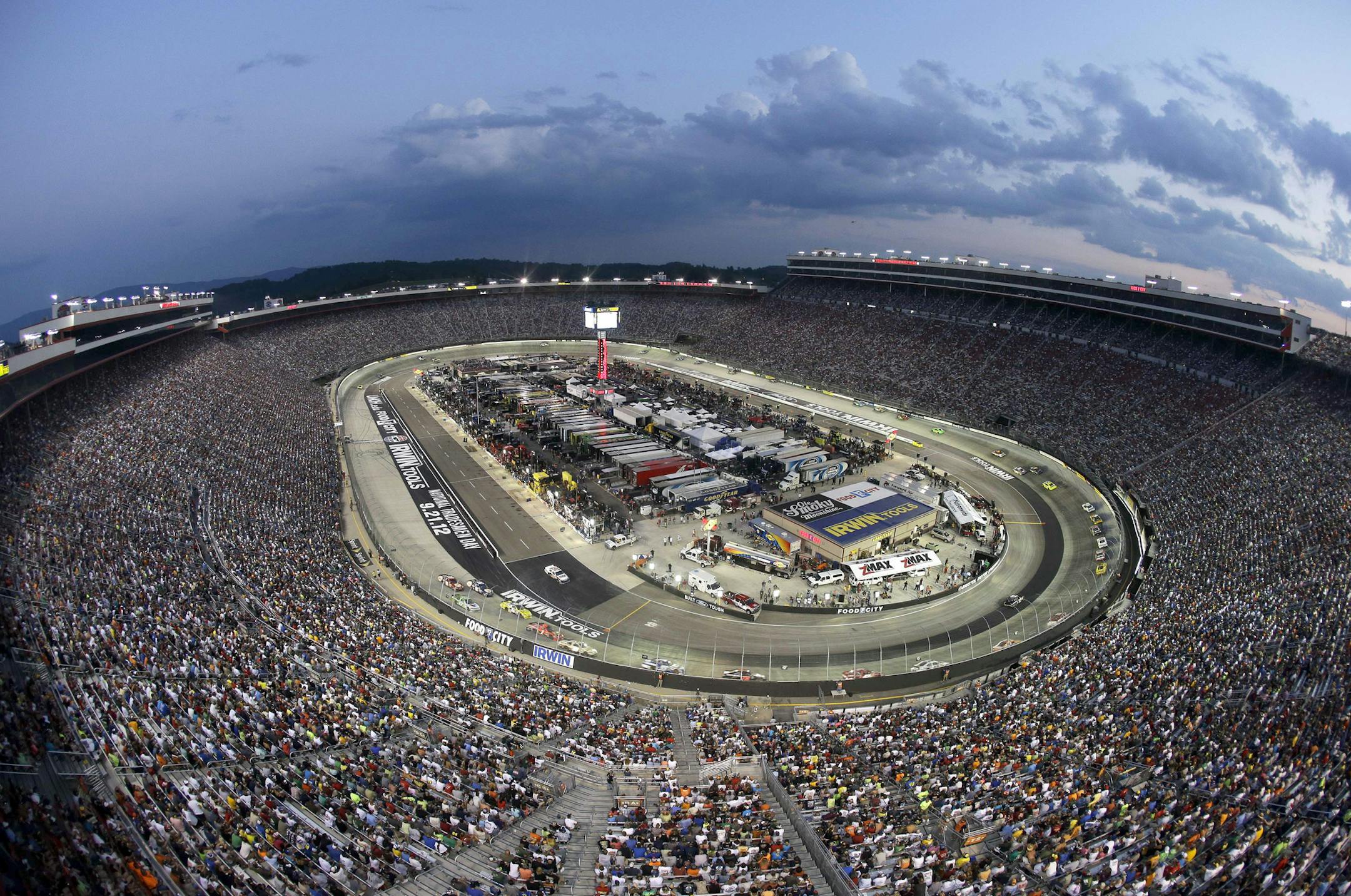 Fans watch the NASCAR Sprint Cup Series auto race Saturday, Aug. 25, 2012, in Bristol, Tenn. (AP Photo/Mark Humphrey) ORG XMIT: TNMH103