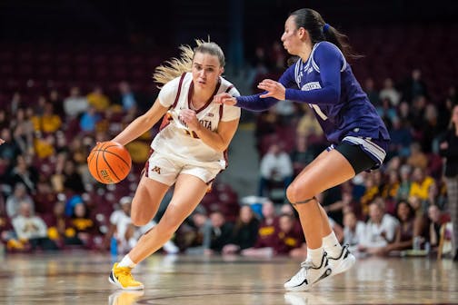 The Gophers' Mara Braun attempts to dribble past Northwestern defender Caroline Lau (7) on Thursday, Jan. 8, 2026, at Williams Arena. (Claudia Staut, Gophers athletics)