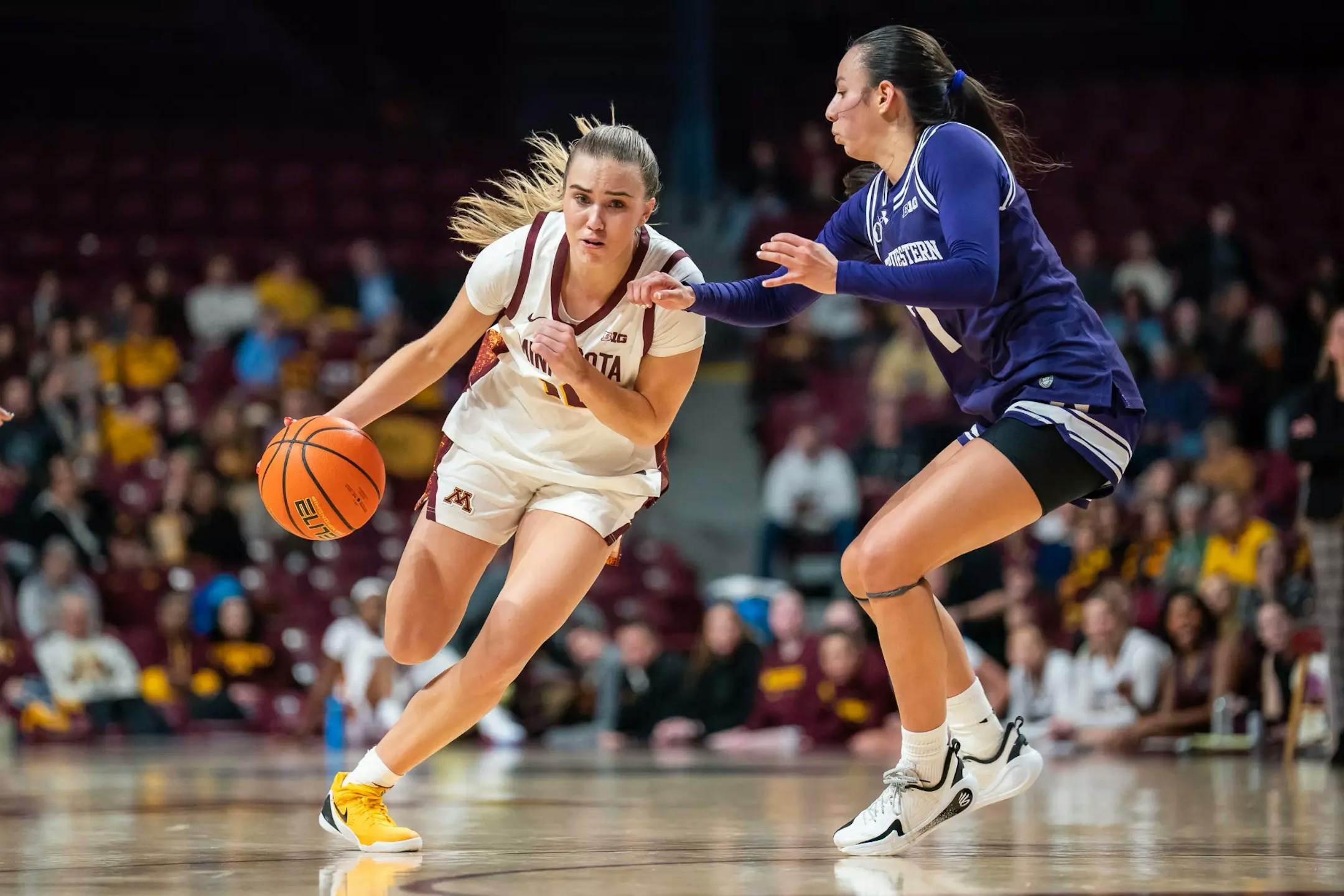 The Gophers' Mara Braun attempts to dribble past Northwestern defender Caroline Lau (7) on Thursday, Jan. 8, 2026, at Williams Arena. (Claudia Staut, Gophers athletics)