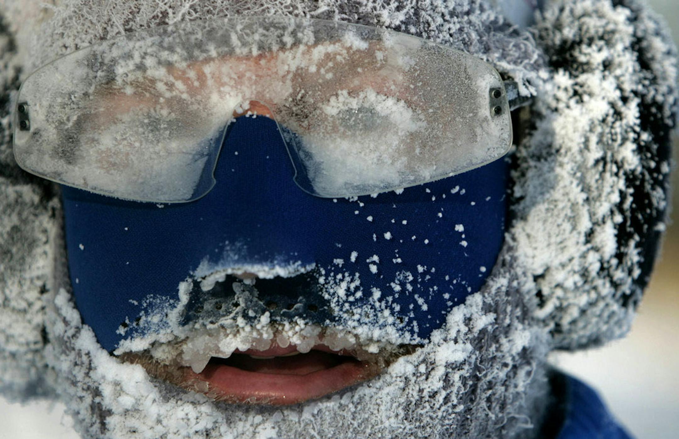 Brave runner Keith Golke of Minneapolis resembles an icicle while jogging around Lake Calhoun Tuesday morning on the coldest day in Minnesota since 2004. While Golke admitted it was cold, "this is nothing," he said. "My record is 25 below zero." An Arctic blast has descended on much of the midwest causing temps to plummet with record breaking lows approaching minus 40 degrees in parts of North Dakota.] **FILE PHOTO** DAVID JOLES • david.joles@startribune.com Runners talk about their trick