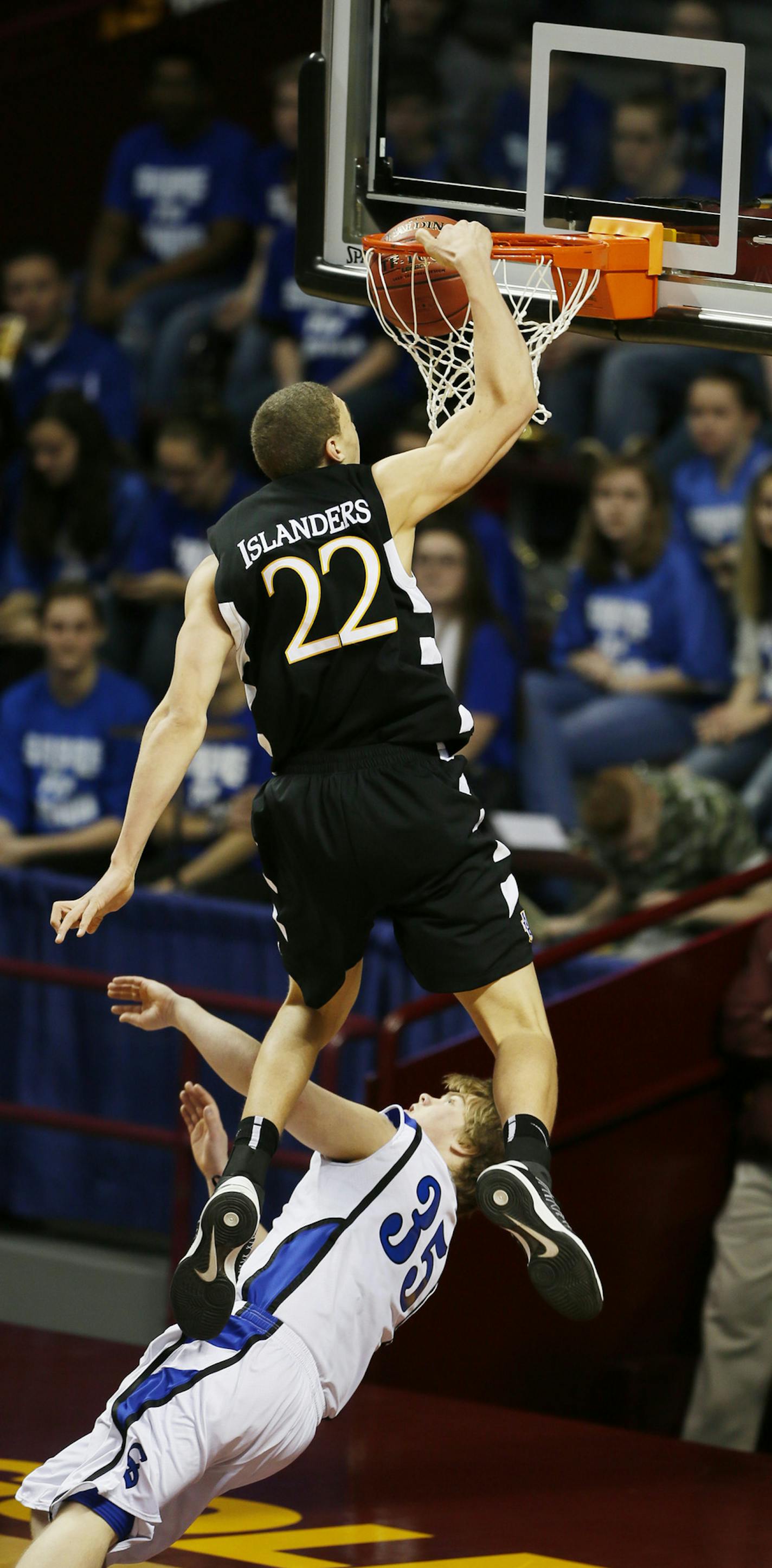 Reid Travis of DeLaSalle dunked over Dylan Hollenkamp of Sartell during 3A quarterfinals basketball action between DeLaSalle and Sartell-St. Stephen at Williams Arena Wednesday March, 20, 2013 in Minneapolis, MN. ] JERRY HOLT &#x201a;&#xc4;&#xa2; jerry.holt@startribune.com