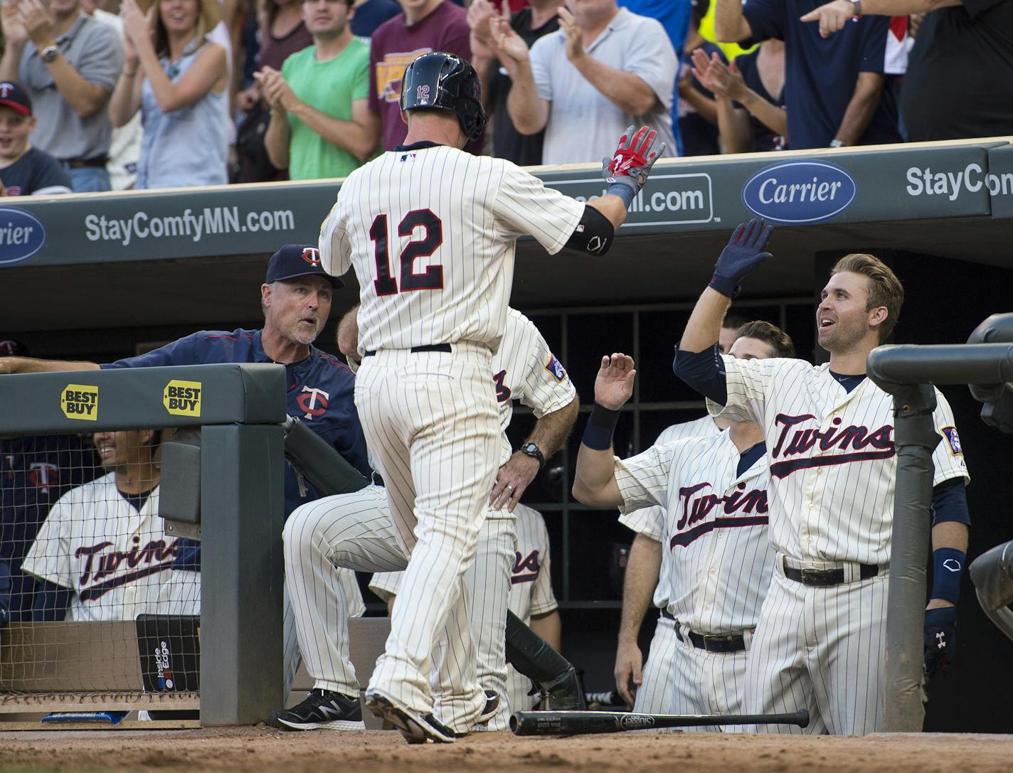 Minnesota Twins catcher Chris Herrmann (12) high fived second baseman Brian Dozier (2) after Herrmann hit a homer against the Cleveland Indians in the bottom of the fifth inning. ] Aaron Lavinsky &#x2022; aaron.lavinsky@startribune.com The Minnesota Twins play the Cleveland Indians Saturday, August 15, 2015 at Target Field in Minneapolis, Minn.