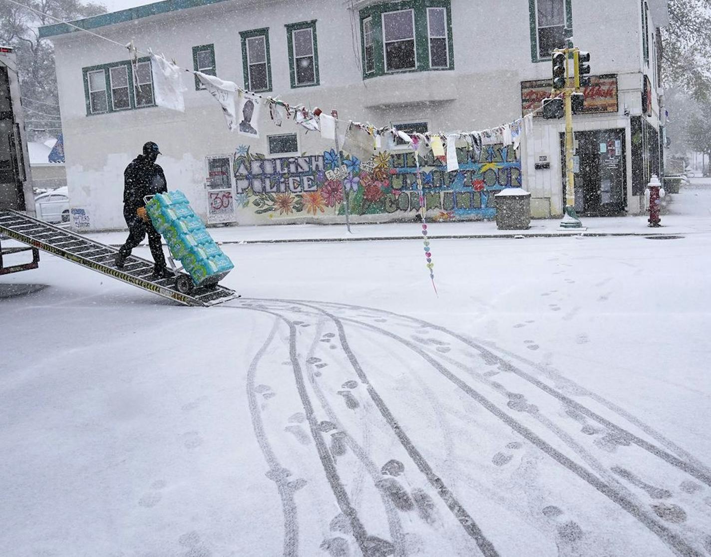 Snow fell on George Floyd Square at the intersection of E. 38th Street and S. Chicago Avenue on Tuesday in Minneapolis.