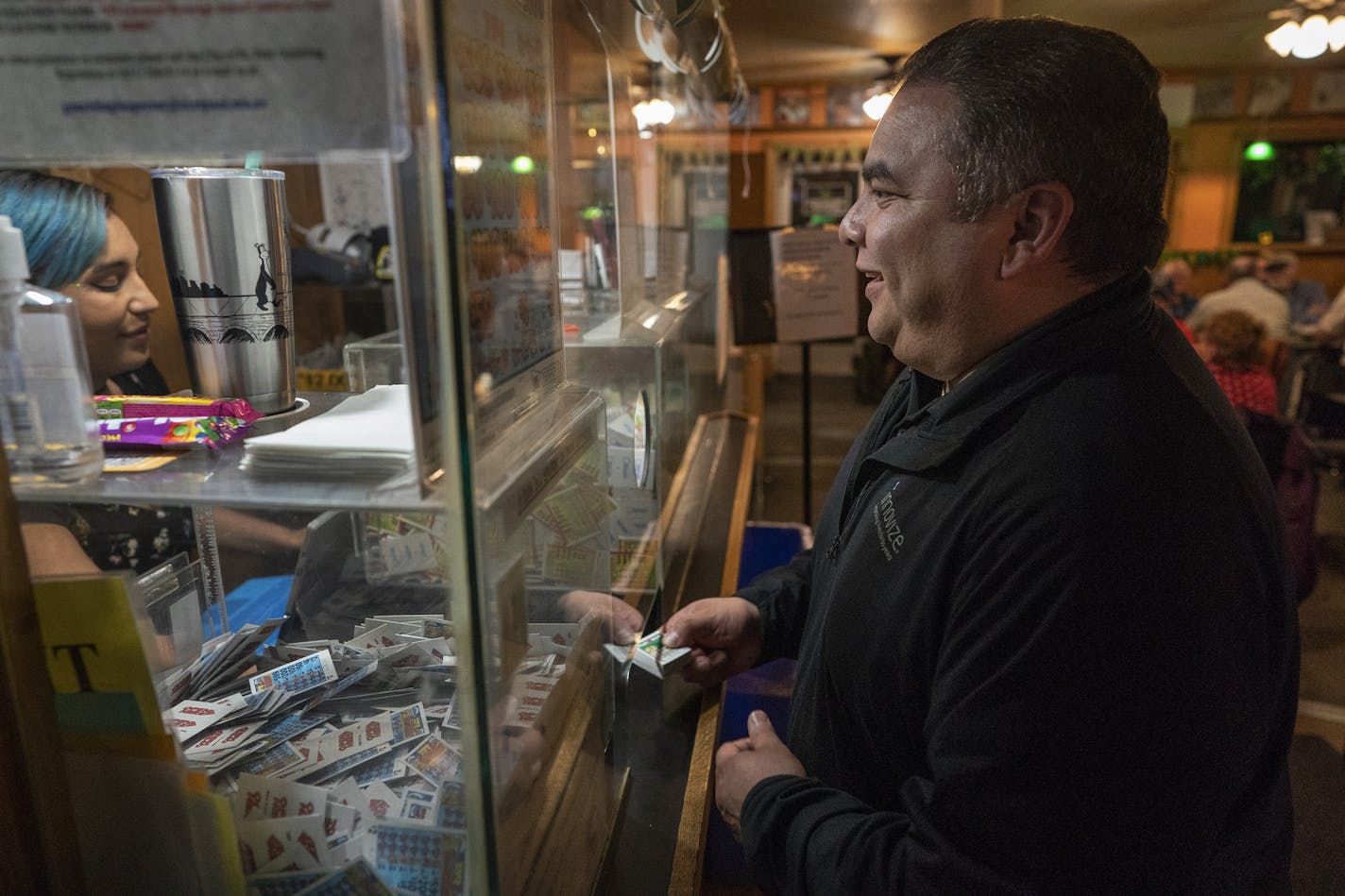 Victor Hernandez of Highland Park purchased forty dollars of pull tabs tickets from Kianna Tichy (cq) Wednesday March 6, 2019 at Skinner's Bar in St.Paul, MN.] Jerry Holt &#x2022; Jerry.holt@startribune.com