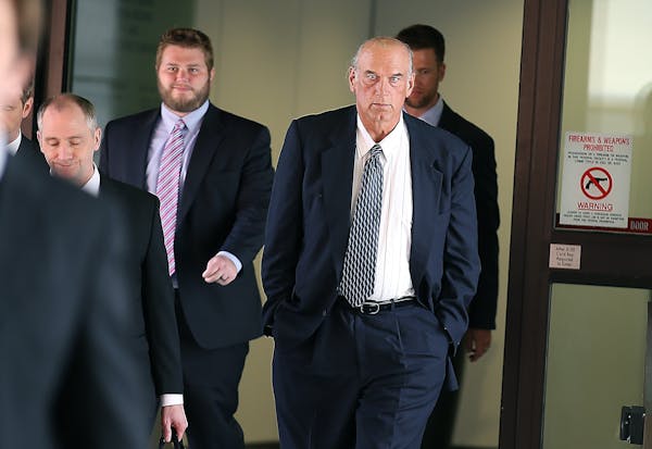 Former Gov. Jesse Ventura made his way out of the Warren E. Burger Federal Building during the first day of his defamation trial, Tuesday, July 8, 201