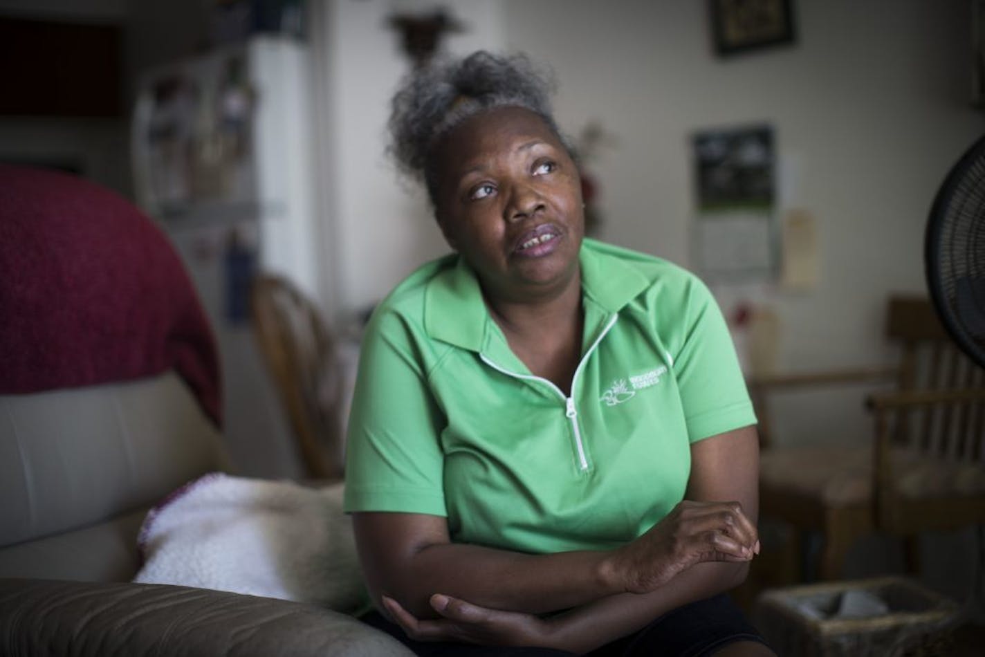 Michelle Washington relies on an average $300 PayDay loan every two weeks to pay her bills. She was photographed at home on Thursday, July 29, 2015, in St. Paul, Minn.