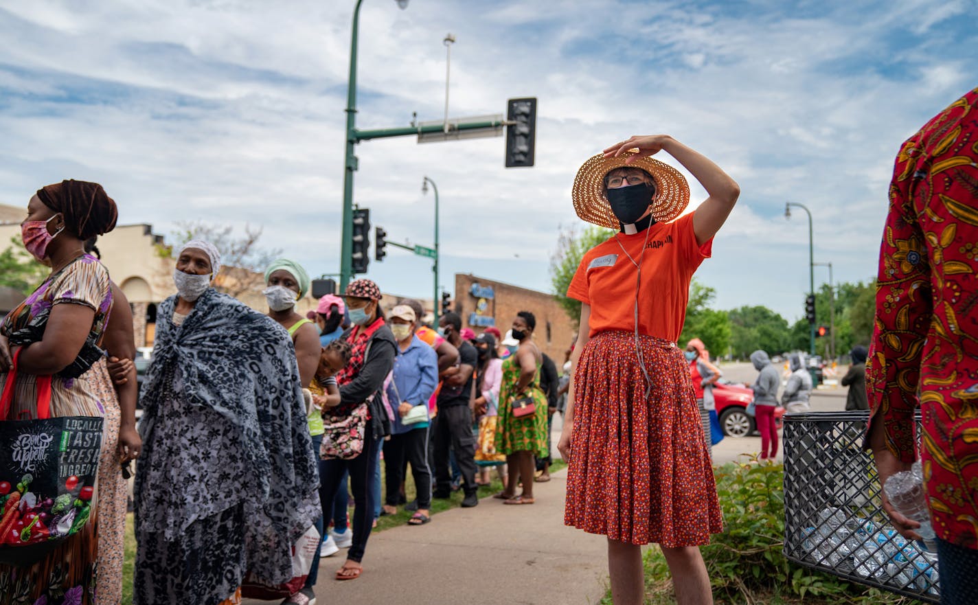 Lutheran minister Bethany Ringdal is one of the volunteer chaplains helping at Holy Trinity Lutheran Church, which has been a major food distribution site since Lake Street burned. She kept a lookout for anyone who needed help or just a bottle of water.