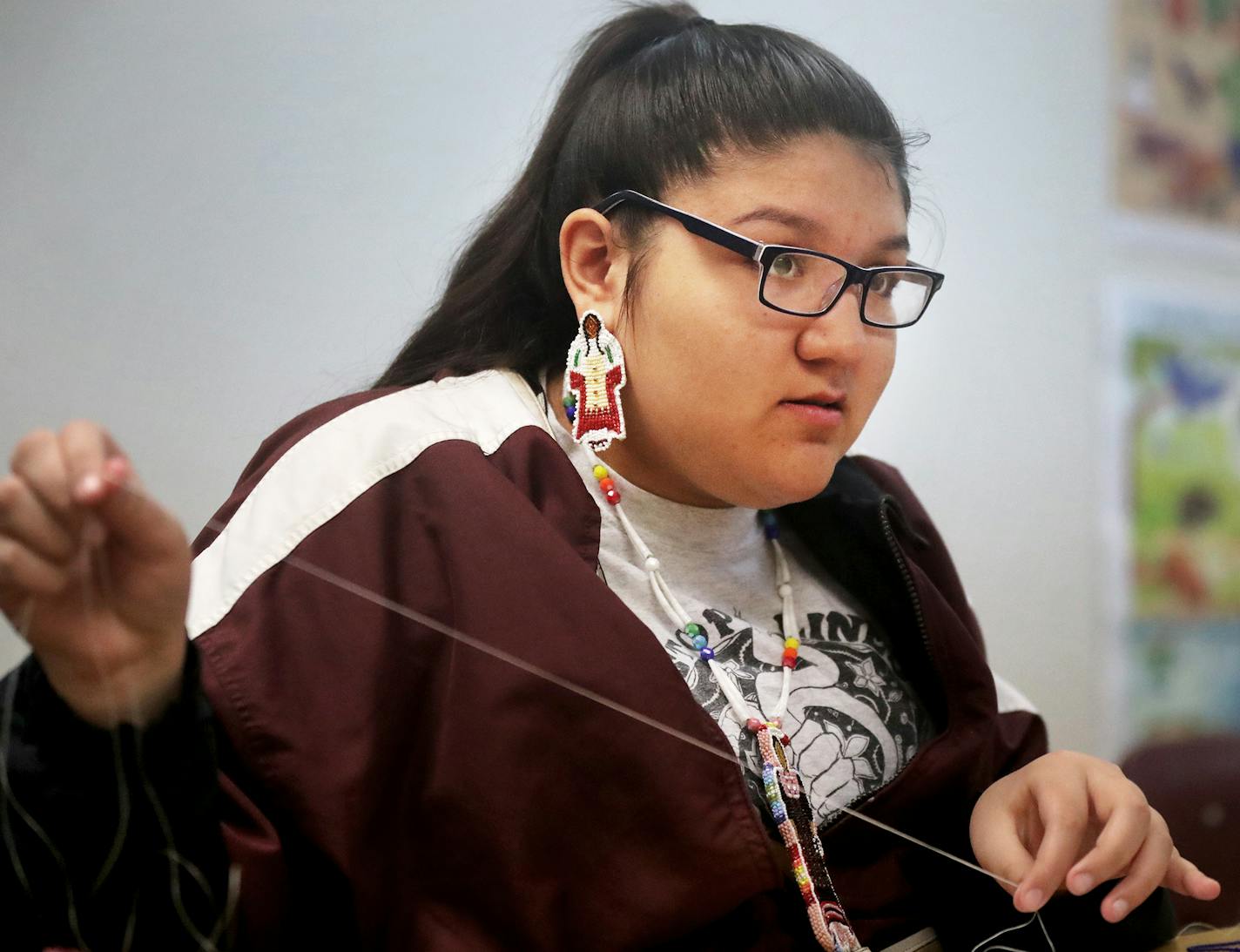 Native American Nina Berglund, 18, will travel to Rome to meet Pope Francis this spring, along with her mother Dianna Johnson and a group of other local Native Americans. Berglund was seen making making moccasins for her Pow Wow regalia Wednesday, March 14, 2018, at the St. Paul Public Schools Indian Education center in St. Paul, MN. Berglund is not Catholic but is an admirer of the Pope. "We just want a better future," she said about the trip to Rome.] DAVID JOLES &#xef; david.joles@startribune