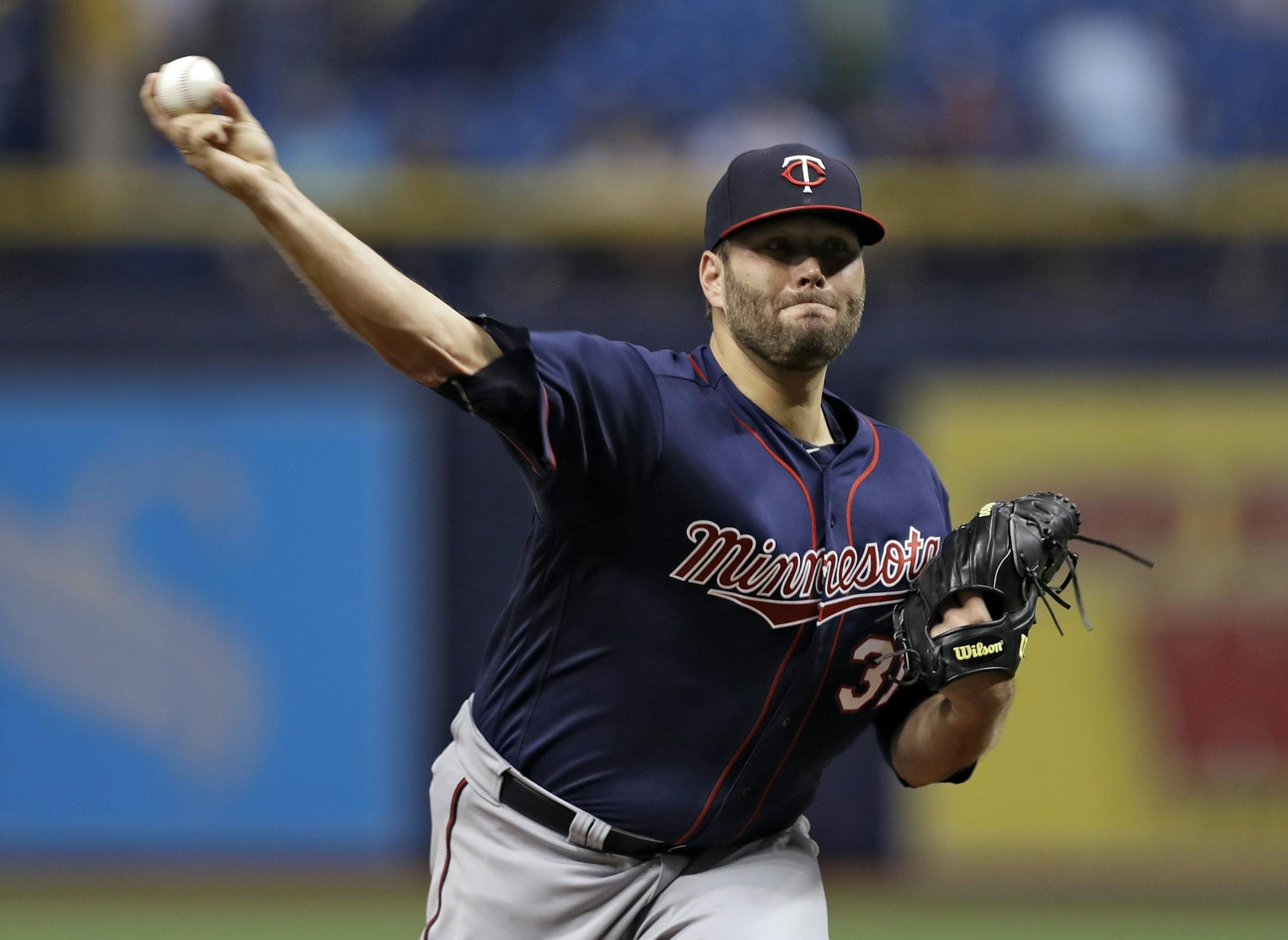 Minnesota Twins starting pitcher Lance Lynn delivers to the Tampa Bay Rays during the first inning of a baseball game Friday, April 20, 2018, in St. Petersburg, Fla.