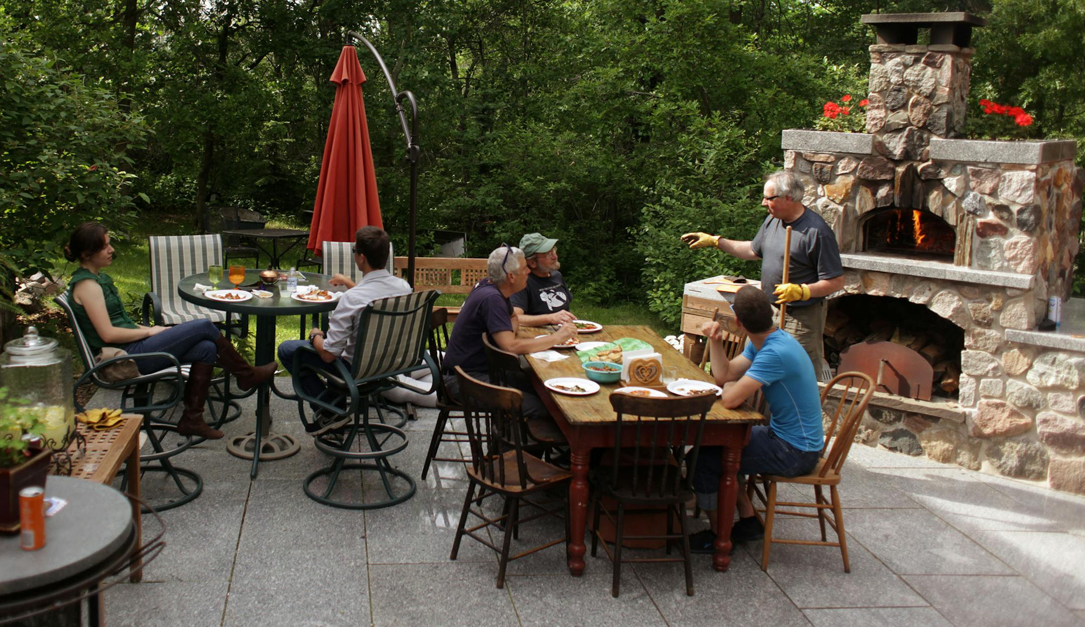 Steve and Claudia Mahon entertain at a pizza party in their backyard.] MONICA HERNDON monica.herndon@startribune.com Hudson, WI 06/13/2014