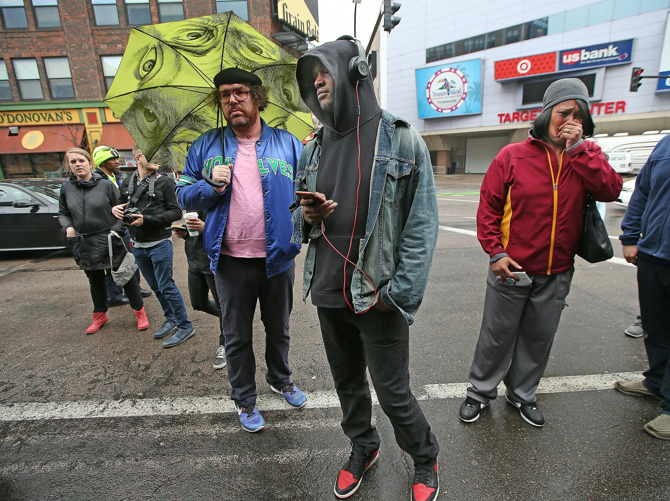 Many began to gather near Prince's star to leave flowers and cry at First Avenue after news of his death was made, Thursday, April 21, 2016 in Minneapolis, MN.