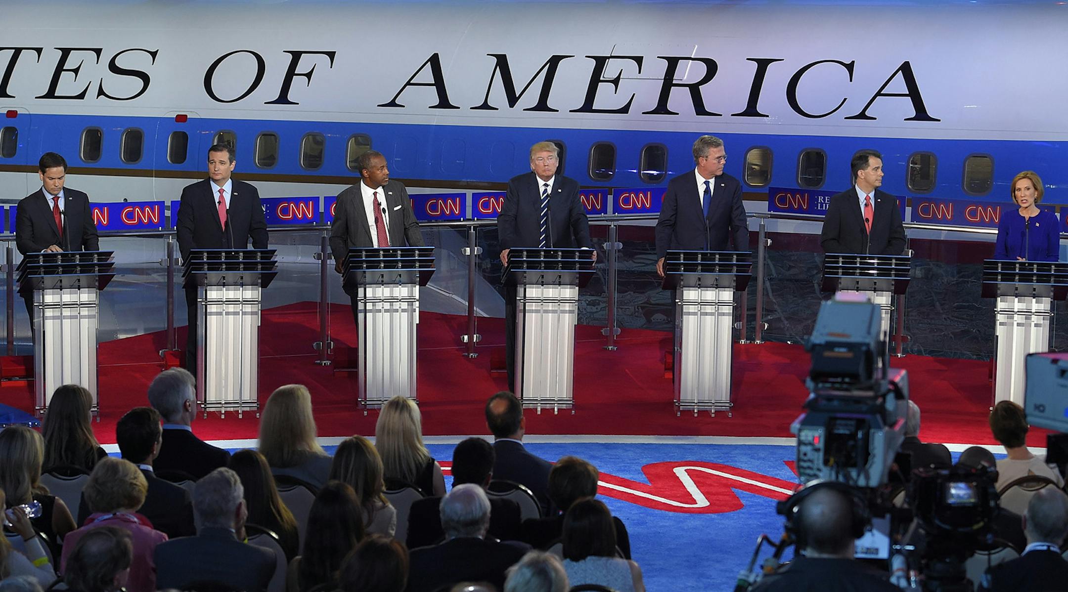 Republican presidential candidates, from left, former Arkansas Gov. Mike Huckabee, Sen. Marco Rubio, R-Fla., Sen. Ted Cruz, R-Texas, retired neurosurgeon Ben Carson, businessman Donald Trump, former Florida Gov. Jeb Bush, Wisconsin Gov. Scott Walker, businesswoman Carly Fiorina, and Ohio Gov. John Kasich, appear during the CNN Republican presidential debate at the Ronald Reagan Presidential Library and Museum on Wednesday, Sept. 16, 2015, in Simi Valley, Calif. (AP Photo/Chris Carlson) ORG XMIT: