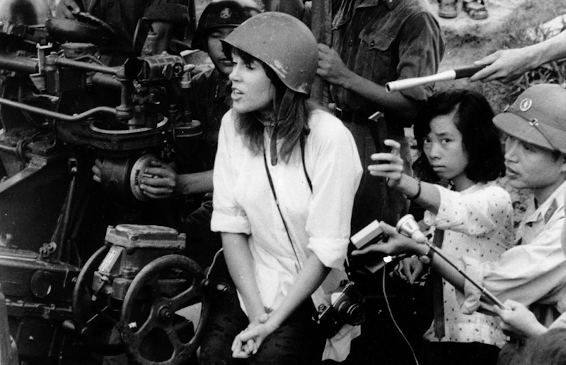 American actress and activist Jane Fonda is surrounded by soldiers and reporters as she sings an anti-war song near Hanoi during the Vietnam War in July 1972.