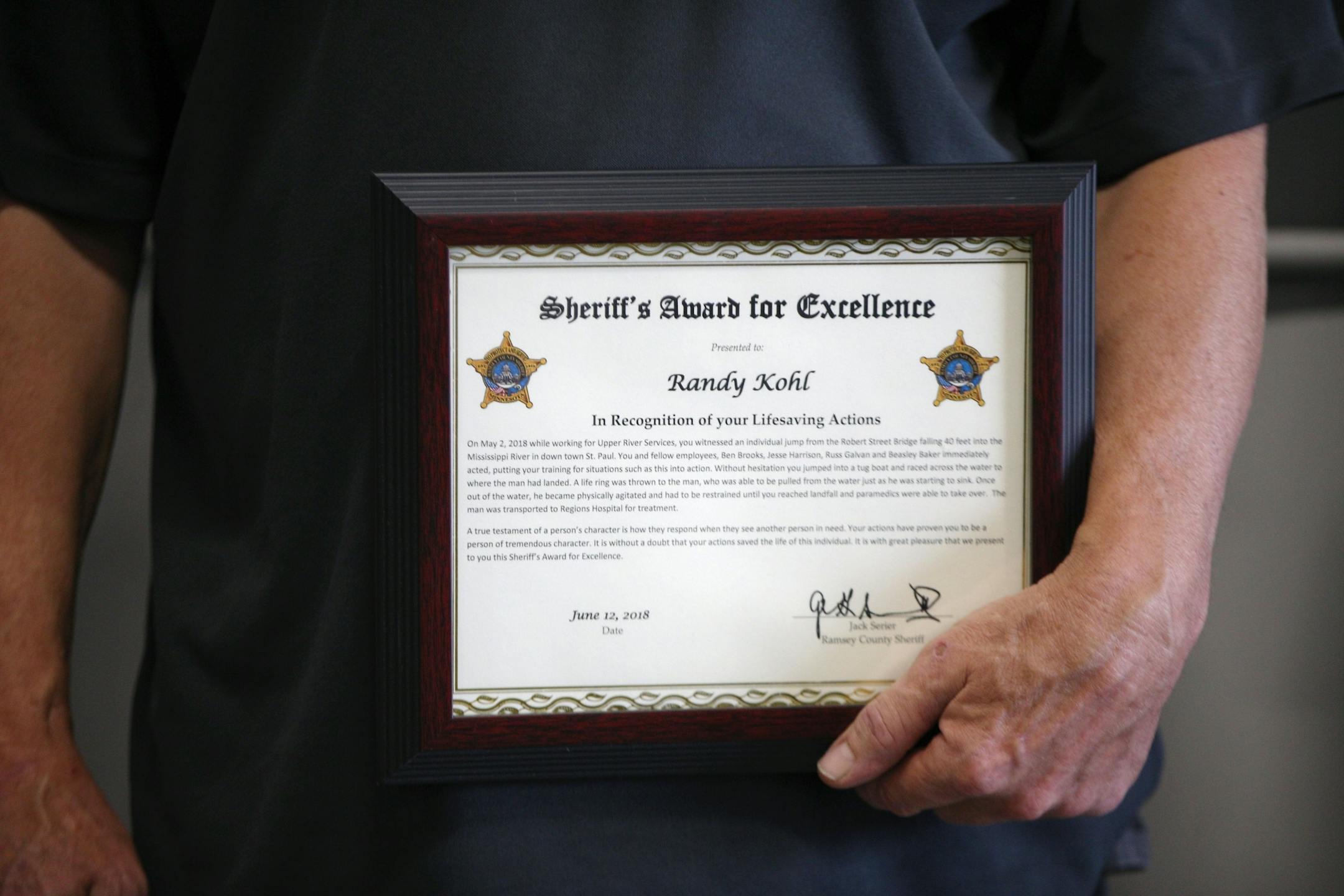 Randy Kohl is one of five men who were honored with the Citizen's Award for Excellence by the Ramsey County Sheriff's Office on Tuesday.