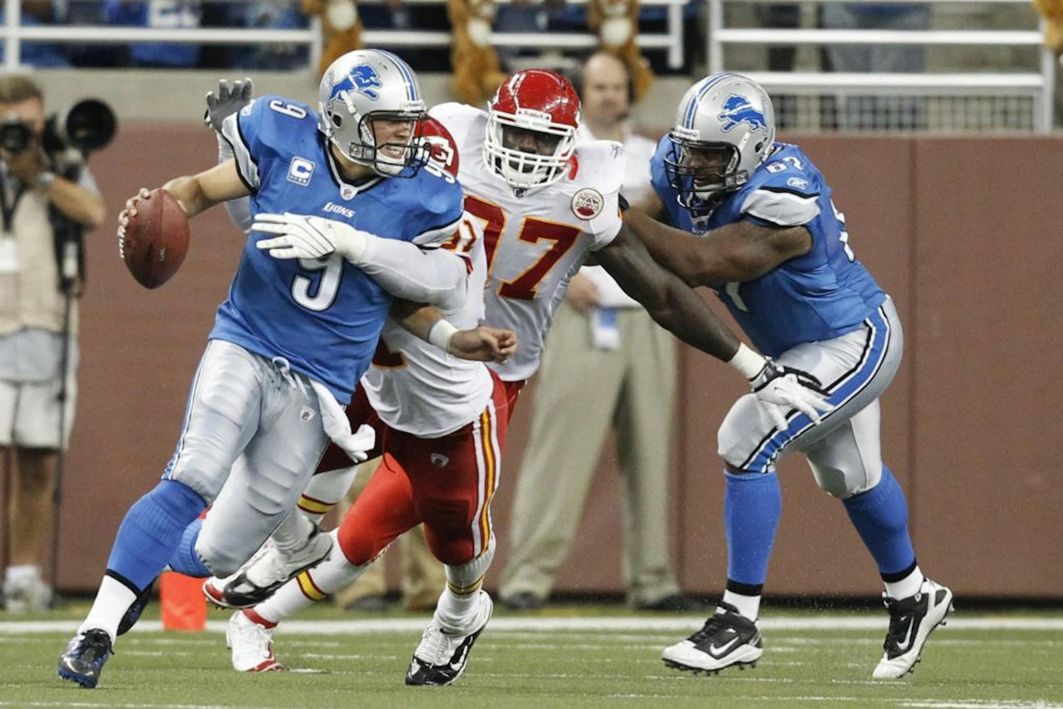 Lions quarterback Matthew Stafford scrambled out of the pocket as Kansas City outside linebacker Tamba Hali tried to sack him. Hali didn't get there, as Stafford has not been sacked this season and is fourth in the league in passing.