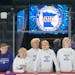 New Ulm boy’s hockey players look out at the ice before taking on Warroad in a Class A boy’s hockey quarterfinal game at Xcel Energy Arena.
