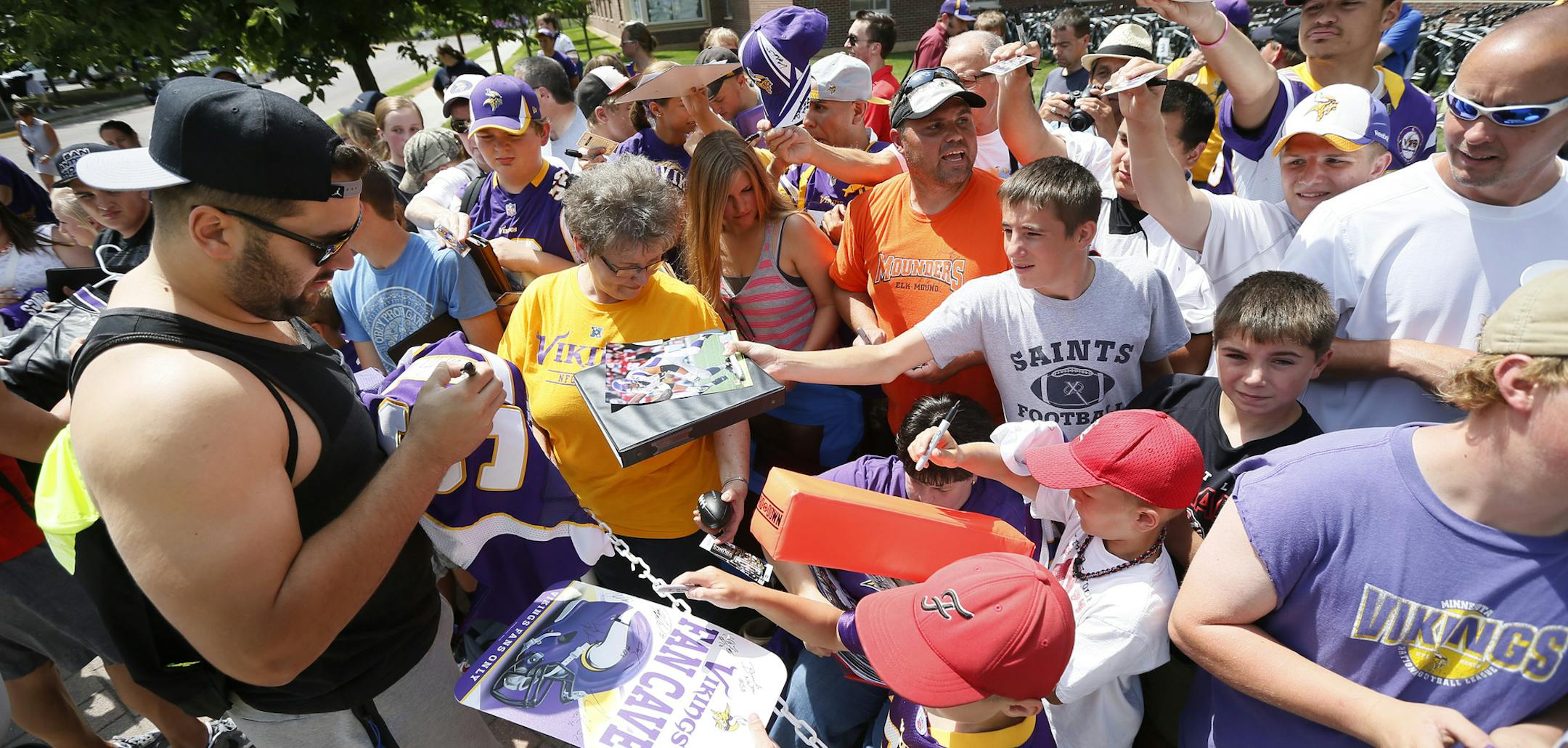 Vikings Matt Kalil singed autographs for fans as players reported for camp at the University of Minnesota Mankato Thursday July 24, 2014 . ] Jerry Holt Jerry.holt@startribune.com