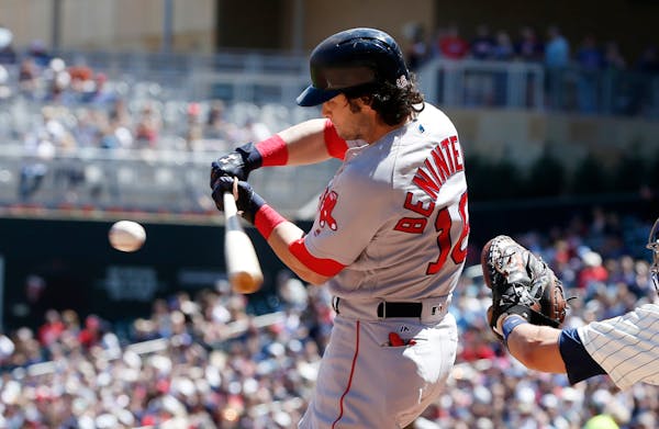 Boston Red Sox's Andrew Benintendi swings for a 2-run double off Minnesota Twins pitcher Nick Tepesch in the second inning of a baseball game Saturday