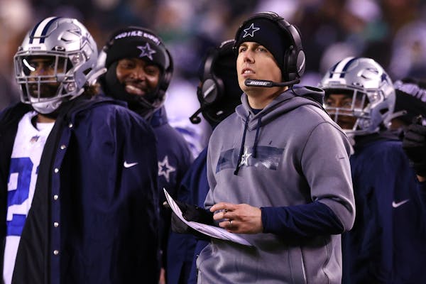 Cowboys offensive coordinator Kellen Moore, right, seems to be the polar opposite of Mike Zimmer. Does that make him the right choice for the Vikings?