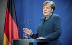 German Chancellor Angela Merkel speaks at a press conference about coronavirus, in Berlin, Sunday, March 22, 2020. German authorities have issued a ba