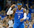 Oklahoma City Thunder forward Carmelo Anthony (7) gestures after hitting a three-point basket in the second quarter of an NBA basketball game against 