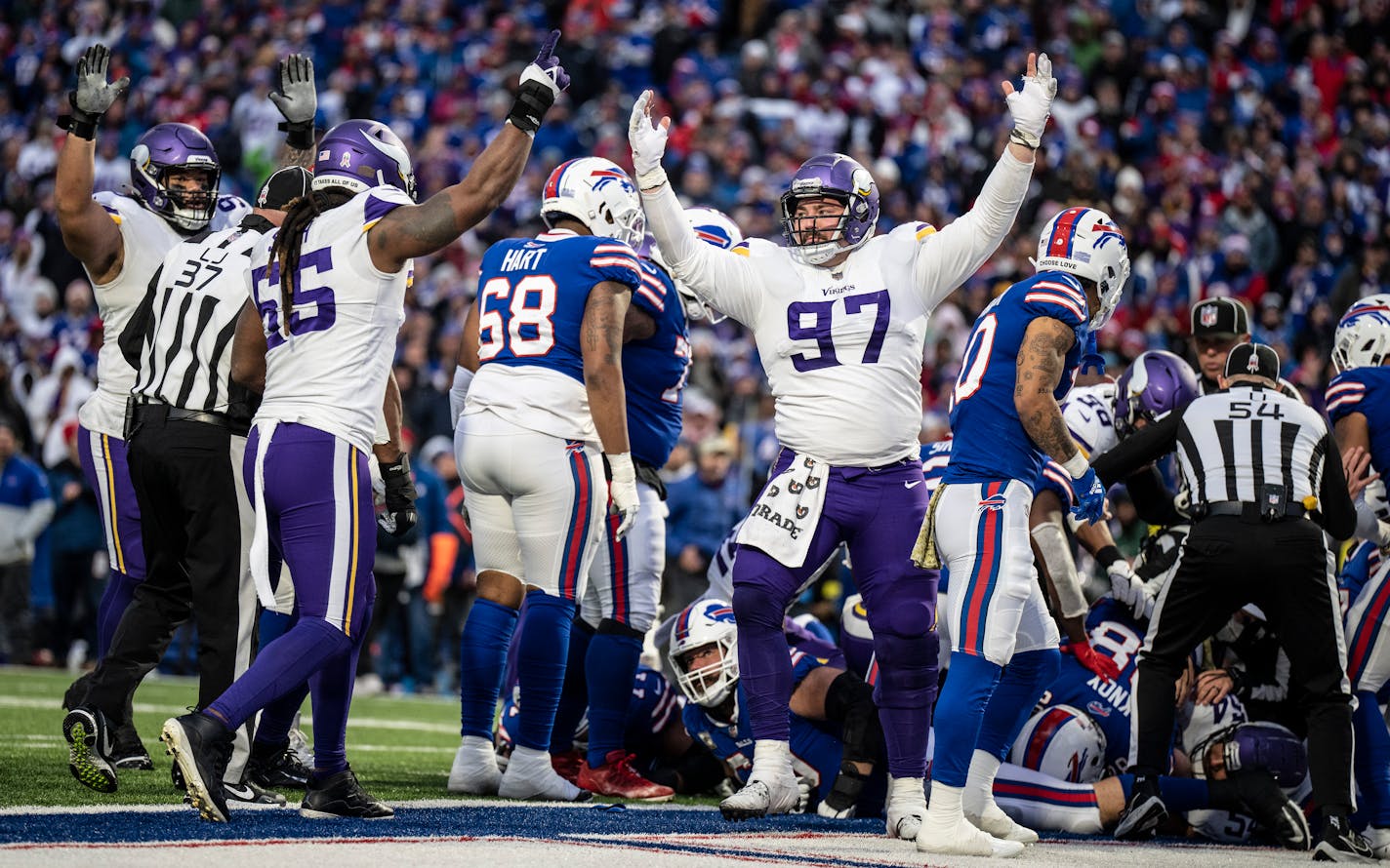 Minnesota Vikings defensive tackle Harrison Phillips (97) and Minnesota Vikings linebacker Za'Darius Smith (55) celebrated linebacker Eric Kendricks fumble recovery in Orchard Park.,N.Y.Sunday November 13, 2022.