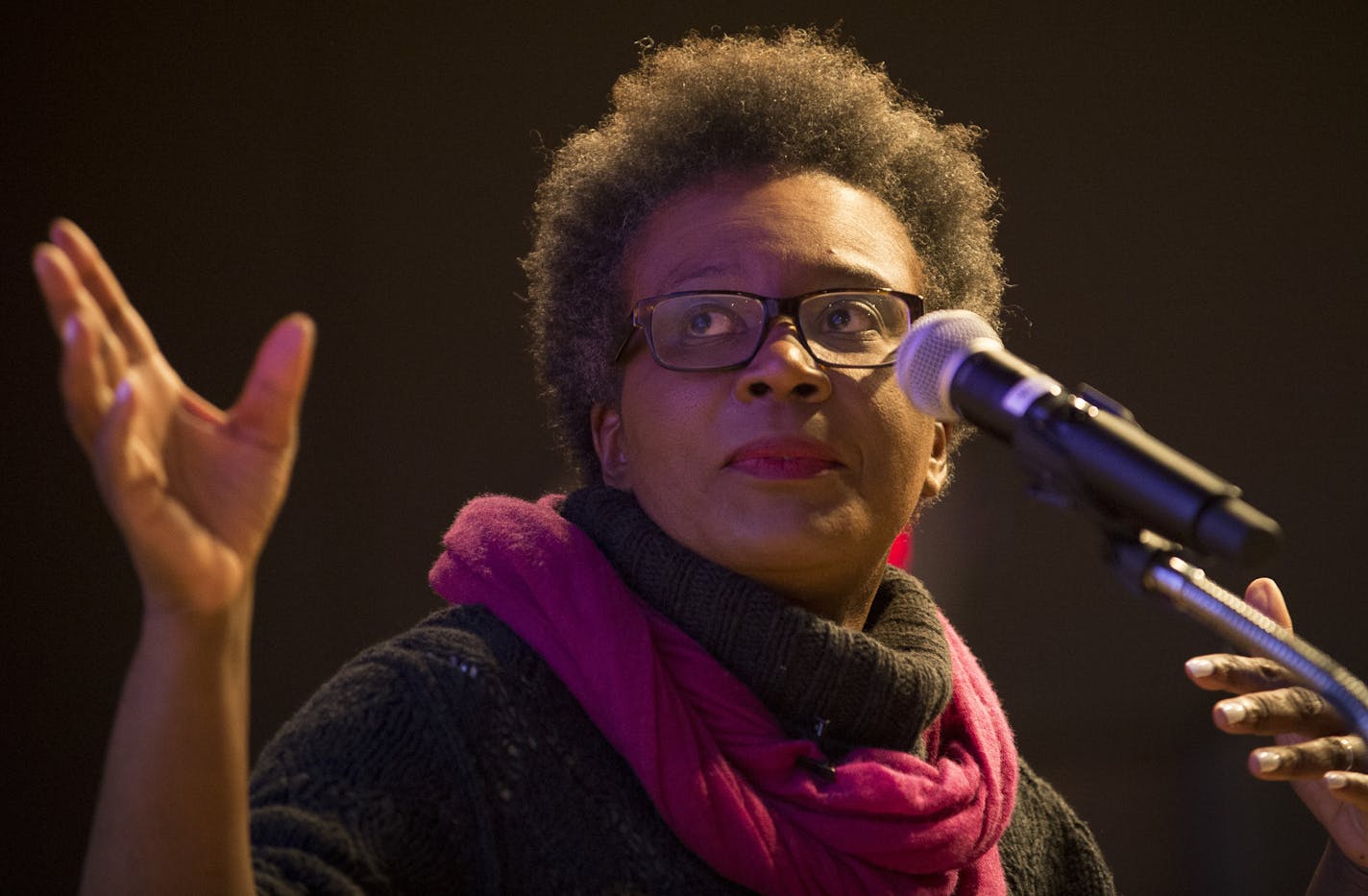 Poet Claudia Rankine references an image being projected behind her during the beginning of her poetry reading on Friday night at the Loft Literary Center. ] (Aaron Lavinsky | StarTribune) St. Paul author Marlon James introduces poet Claudia Rankine at the Loft Literary Center on Friday, Jan. 30, 2015 in Minneapolis. She is published by Graywolf Press, and her book, "Citizen," was a finalist for the National Book Award. It is currently a finalist for the National Book Critics Circle Award in two