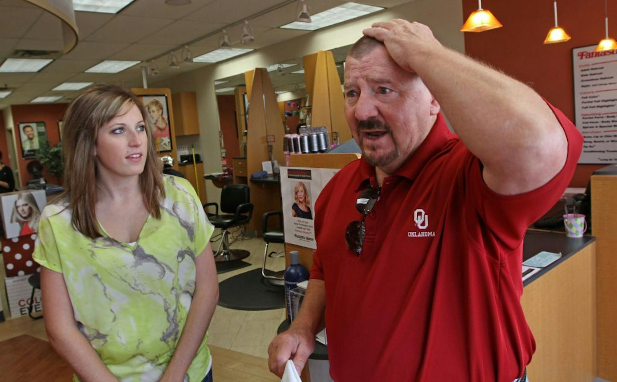 Worth 'humongous tips': Fantastic Sam's stylist Felicia Reed and customer J.T. Taylor. Thanks to Reed's diligence, Taylor has a good reason to joke about his new tonsorial appearance.