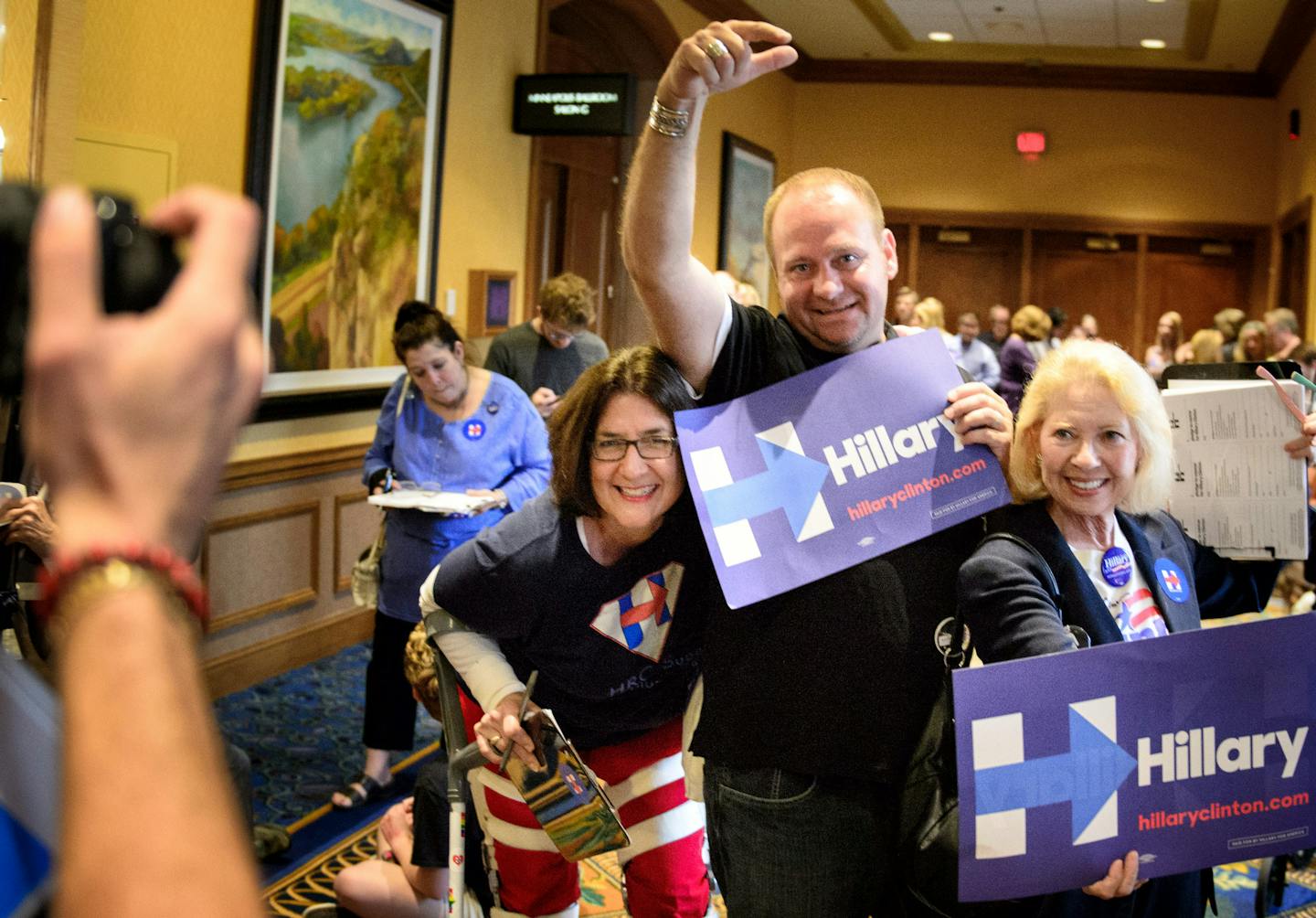 Hillary Clinton campaign volunteers Jennifer McCann, Jim Livesey and Elli Klein were among supporters who lined up for tickets to attend the DNC meeting.