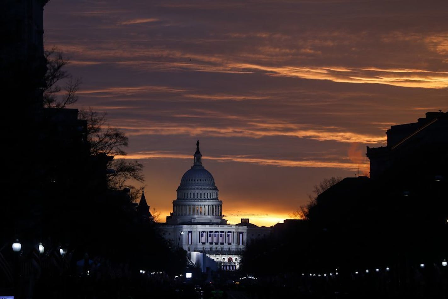 The Capitol Building is illuminated against the sunrise before the presidential inauguration of President-elect Donald Trump, Friday, Jan. 20, 2017, in Washington.