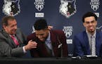 Karl-Anthony Towns (second from left) and Tyus Jones share a light moment with head coach Flip Saunders during a news conference Friday afternoon.