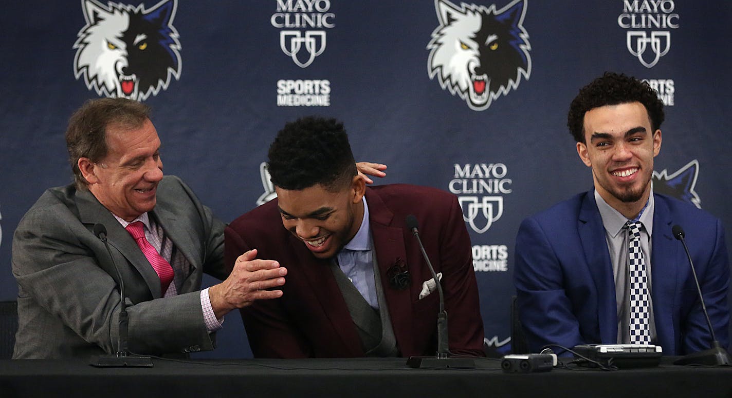 Karl-Anthony Towns (second from left) and Tyus Jones share a light moment with head coach Flip Saunders during a news conference Friday afternoon.