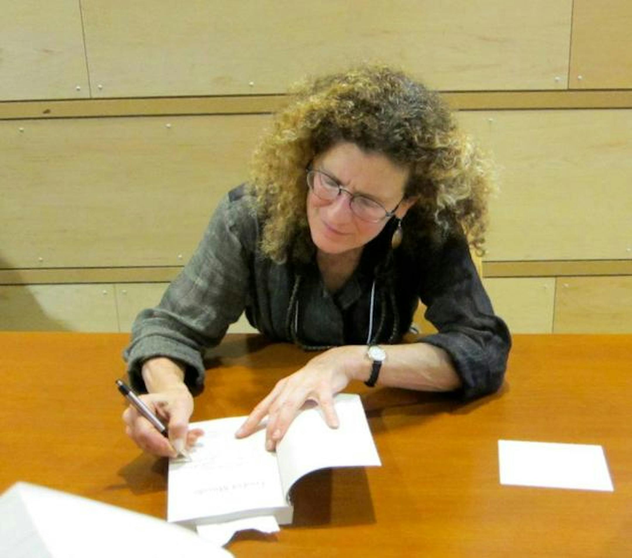 Jaimy Gordon autographs "Lord of Misrule" at the Rain Taxi Book Festival in Minneapolis last October. Photo by Laurie Hertzel.
