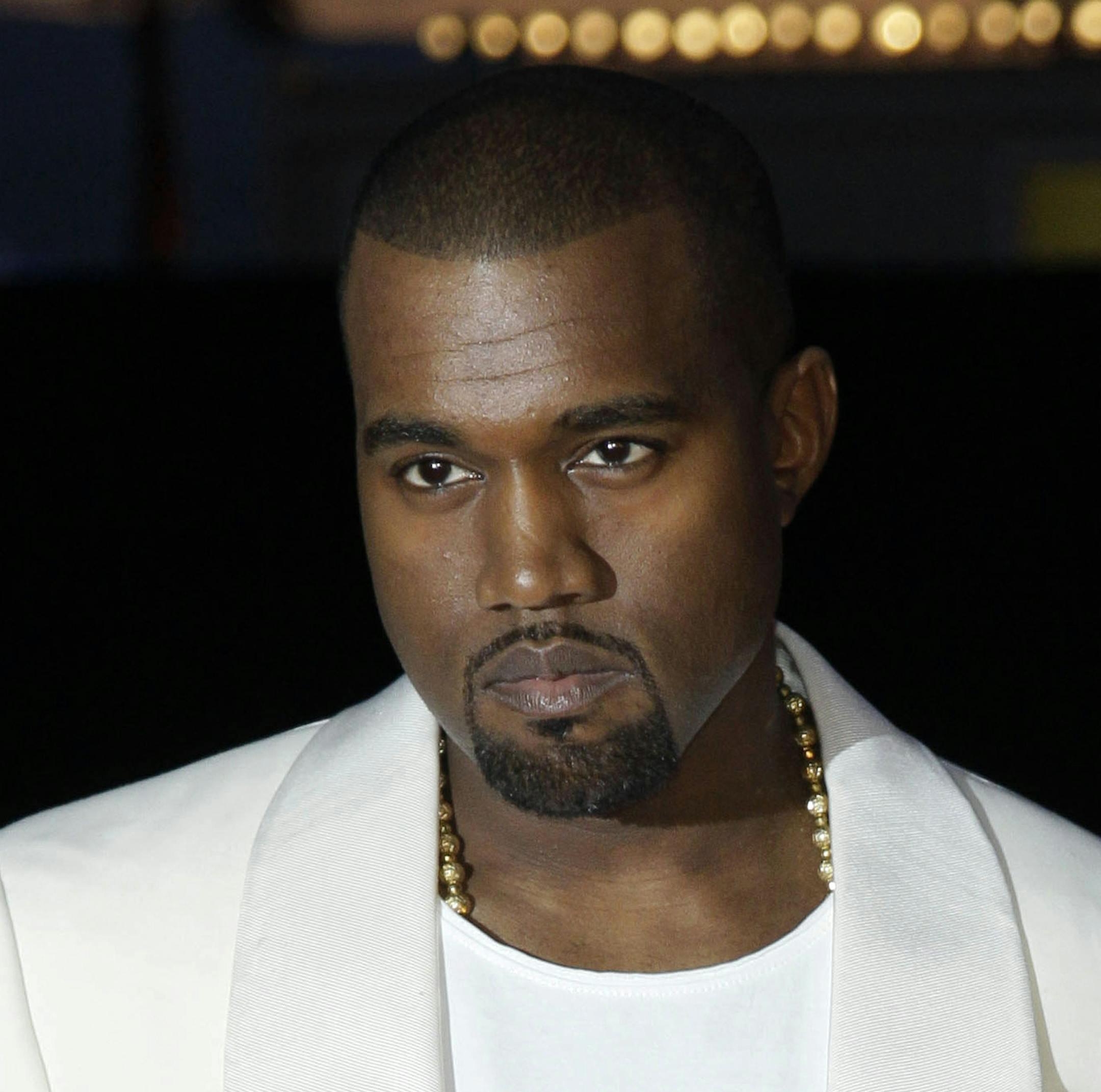 FILE - In this May 23, 2012 file photo, singer Kanye West arrives for the screening of "Cruel Summer" at the 65th international film festival, in Cannes, southern France. Kanye West will visit the White House on Thursday to meet with President Donald Trump and his son-in-law Jared Kushner talk about manufacturing in America, gang violence, prison reform and Chicago violence. (AP Photo/Francois Mori, File)