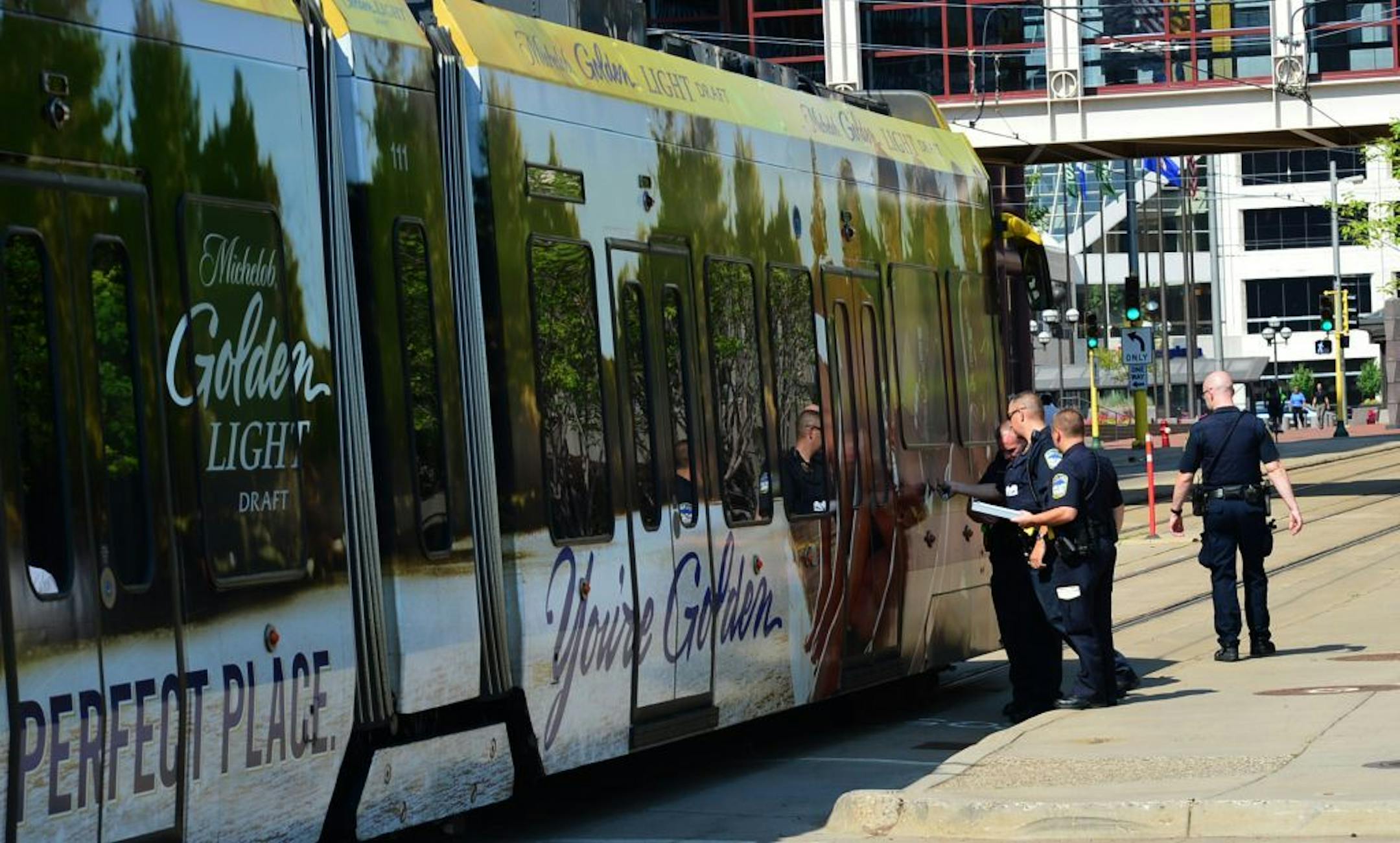 Light-rail service heading into downtown Minneapolis was briefly halted late Monday morning when a train collided with a commercial van at 5th Street and 5th Avenue.
