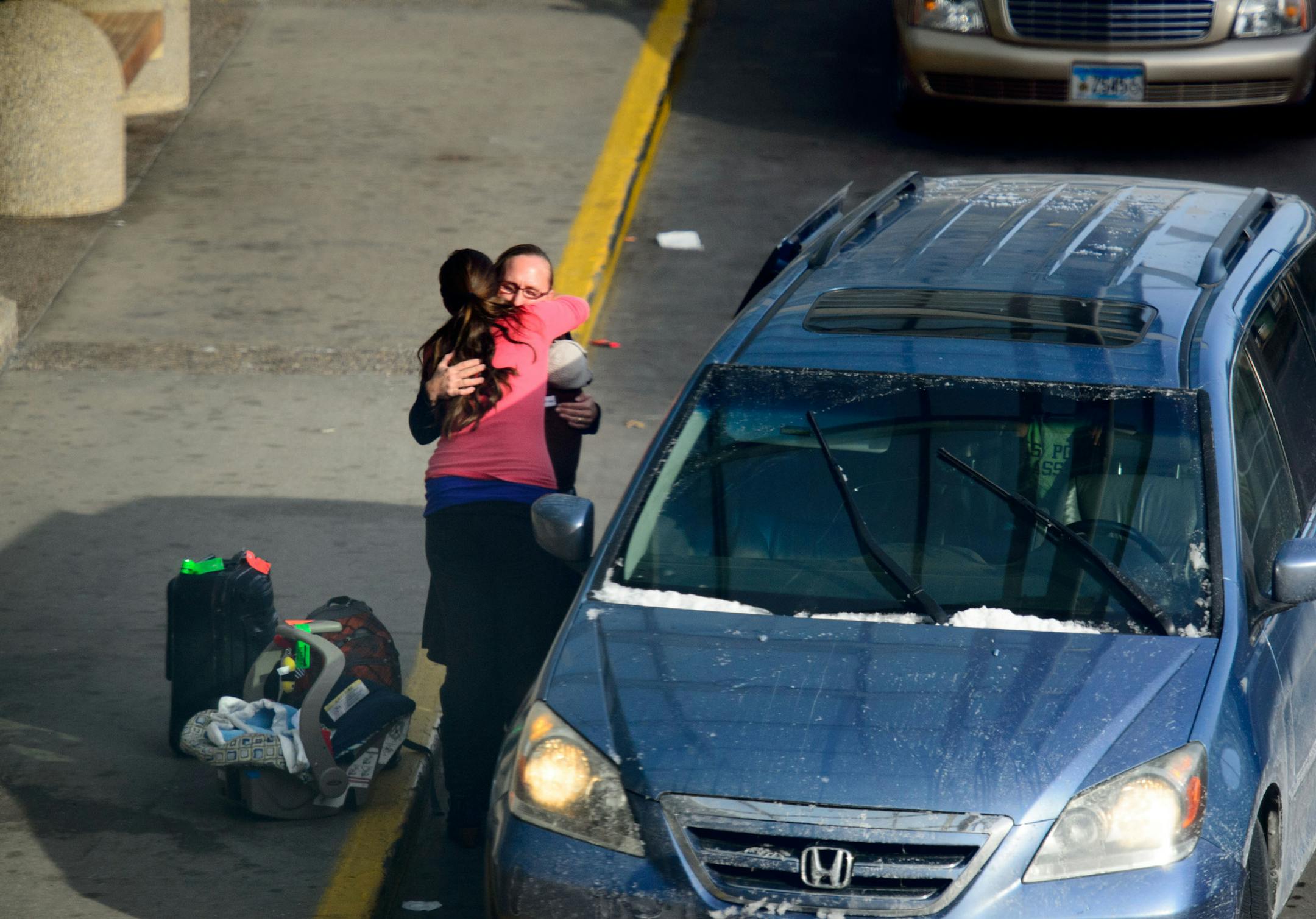 Travelers said goodbye at the drop-off curb at Terminal 1, also known as the Lindbergh, or main, terminal.