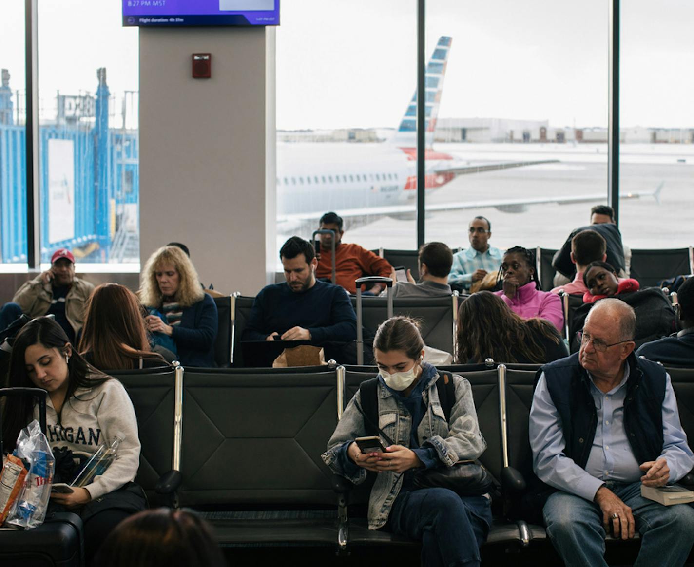 A traveler wears a face mask at an airport near Detroit, Feb. 27, 2020.