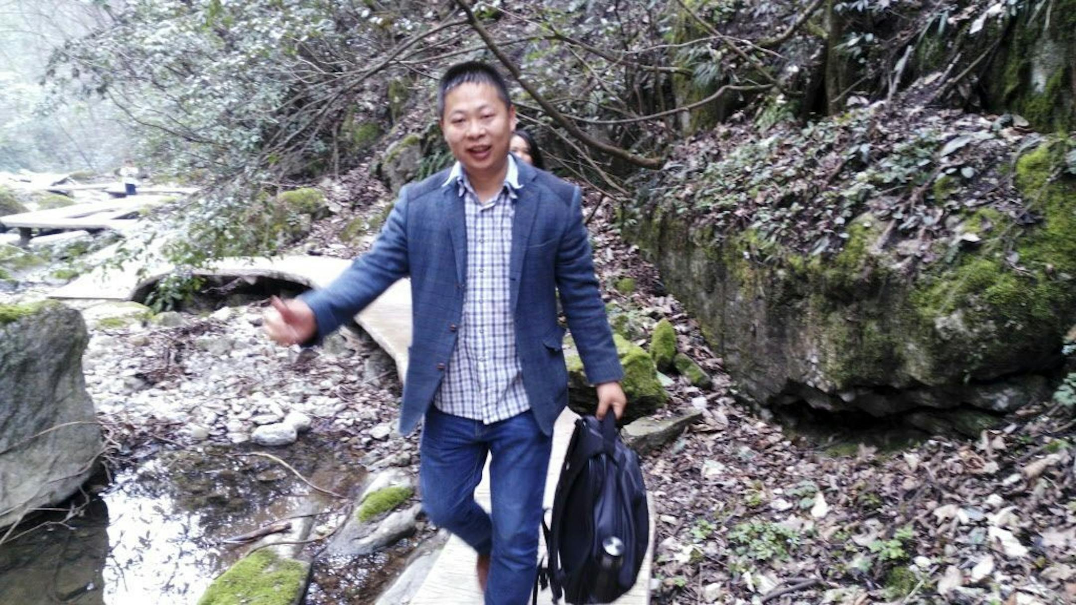 In this photo from March 2016 and released by Deng Guilian, Li Zhao is seen at a scenic spot in Nanzhang county, Xianyang city, in central China's Hubei province. The State Department called June 5, 2017, for the immediate release of three labor activists, including Li, who investigated a Chinese company that produced Ivanka Trump shoes in China. The Associated Press reported that the men were arrested or went missing last week.