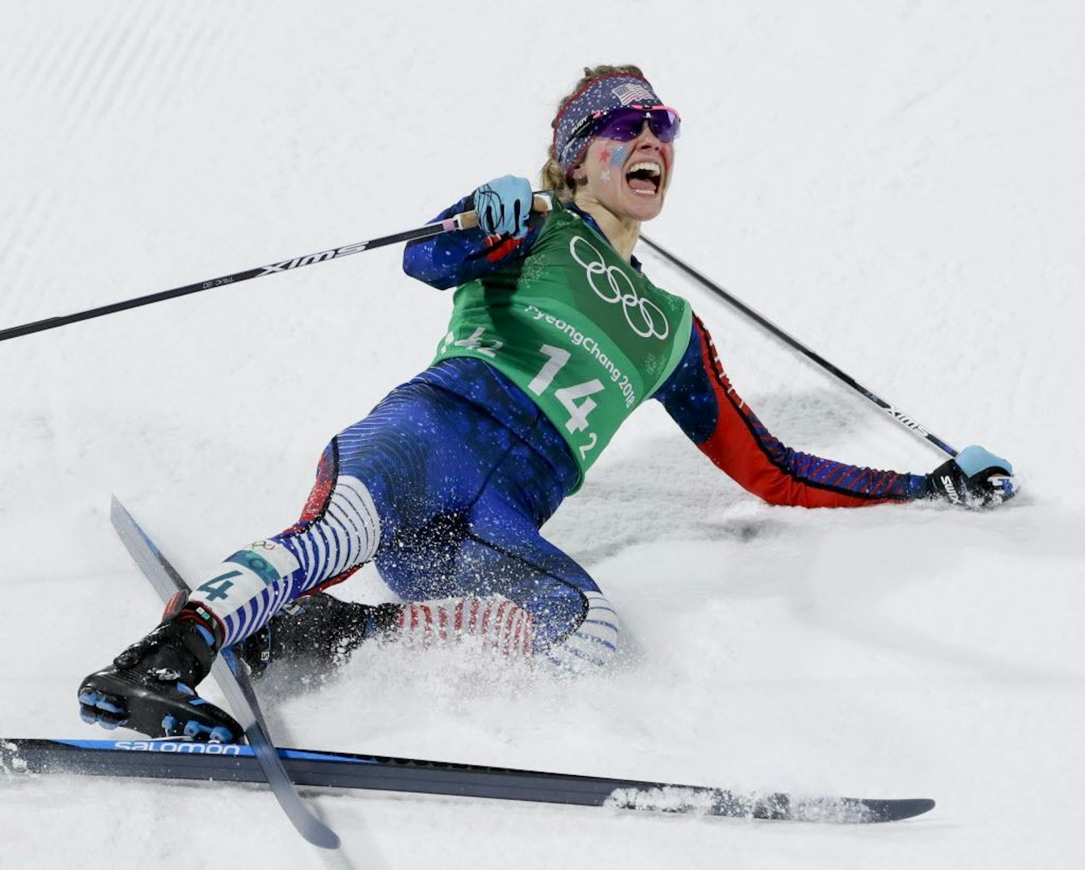 Jessie Diggins, of the United States, celebrates after winning the gold medal in the during women's team sprint freestyle cross-country skiing final at the 2018 Winter Olympics.