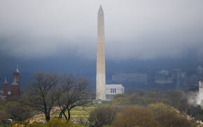 Storm clouds form around the Washington Monument and Lincoln Memorial in Washington, Thursday, April 6, 2017. A severe thunderstorm warning was in eff