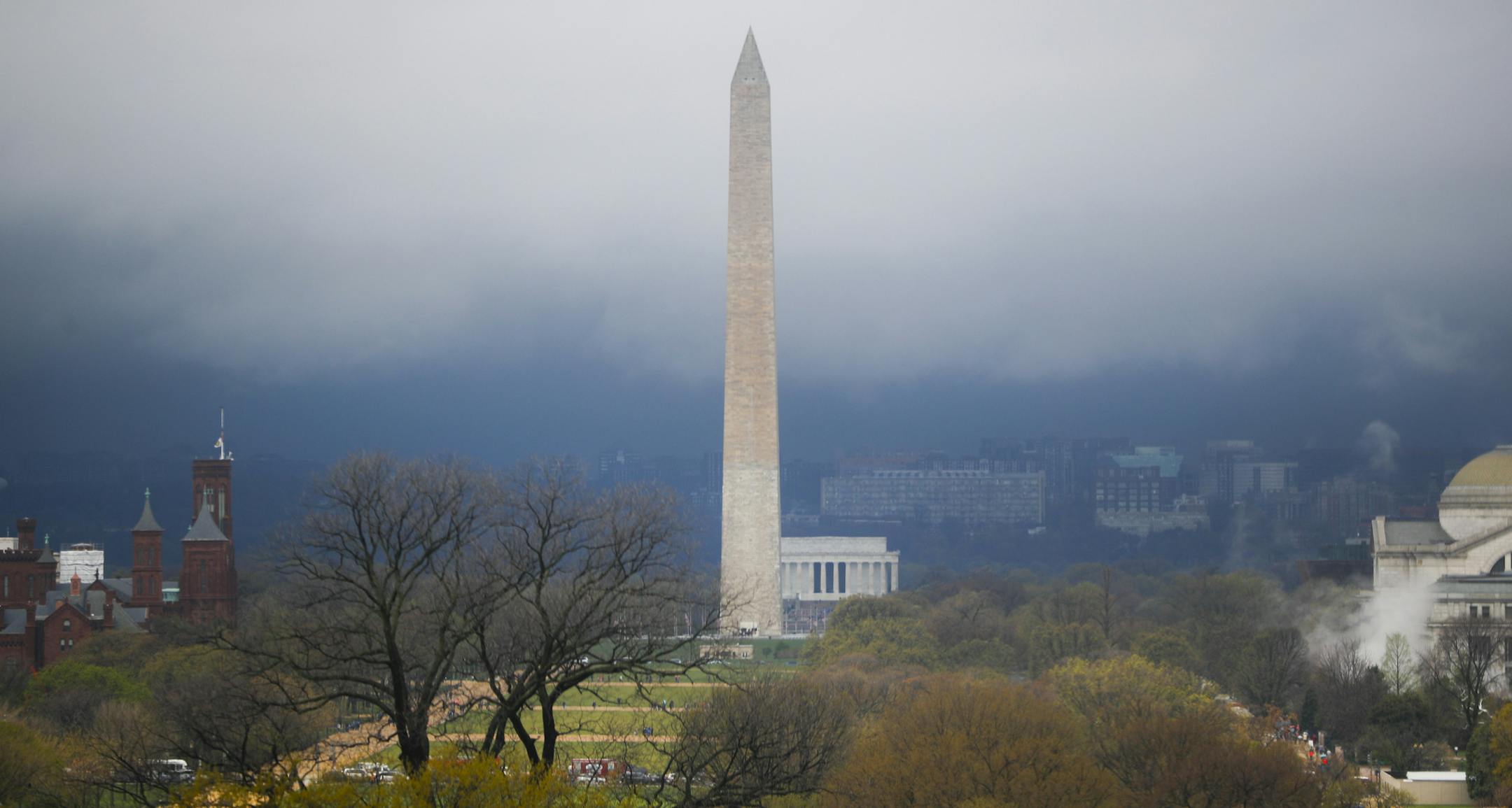 Storm clouds form around the Washington Monument and Lincoln Memorial in Washington, Thursday, April 6, 2017. A severe thunderstorm warning was in effect for much of the DC Metro area, with periods of heavy rain, thunderstorms and strong winds moving through the region. (AP Photo/Pablo Martinez Monsivais)