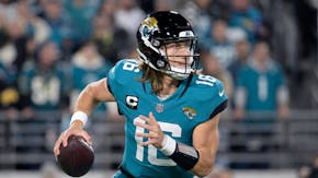 Trevor Lawrence and the Jacksonville Jaguars agreed Thursday to a five-year, $275 million contract extension that makes him one of the highest-paid qu