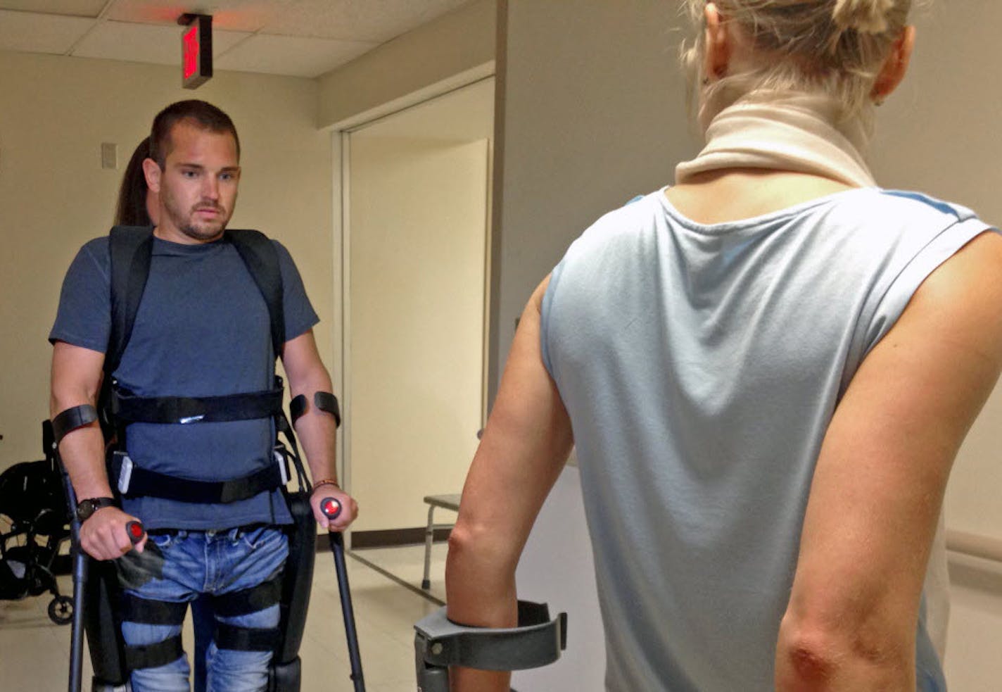 &#x201c;Moving forward was unreal&#x201d;: Isaac Schreurs, of Sioux Falls, S.D., has been paralyzed from the chest down for a decade &#x2014; yet he walked again this week at the Courage Kenny Rehabilitation Institute in Minneapolis. He was test-driving the only federally approved exoskeleton for personal use. At right, the battery-powered device &#x2014; the ReWalk Personal Exoskeleton &#x2014; consists of two mechanically driven legs that join at the hips, with a seat that folds up.