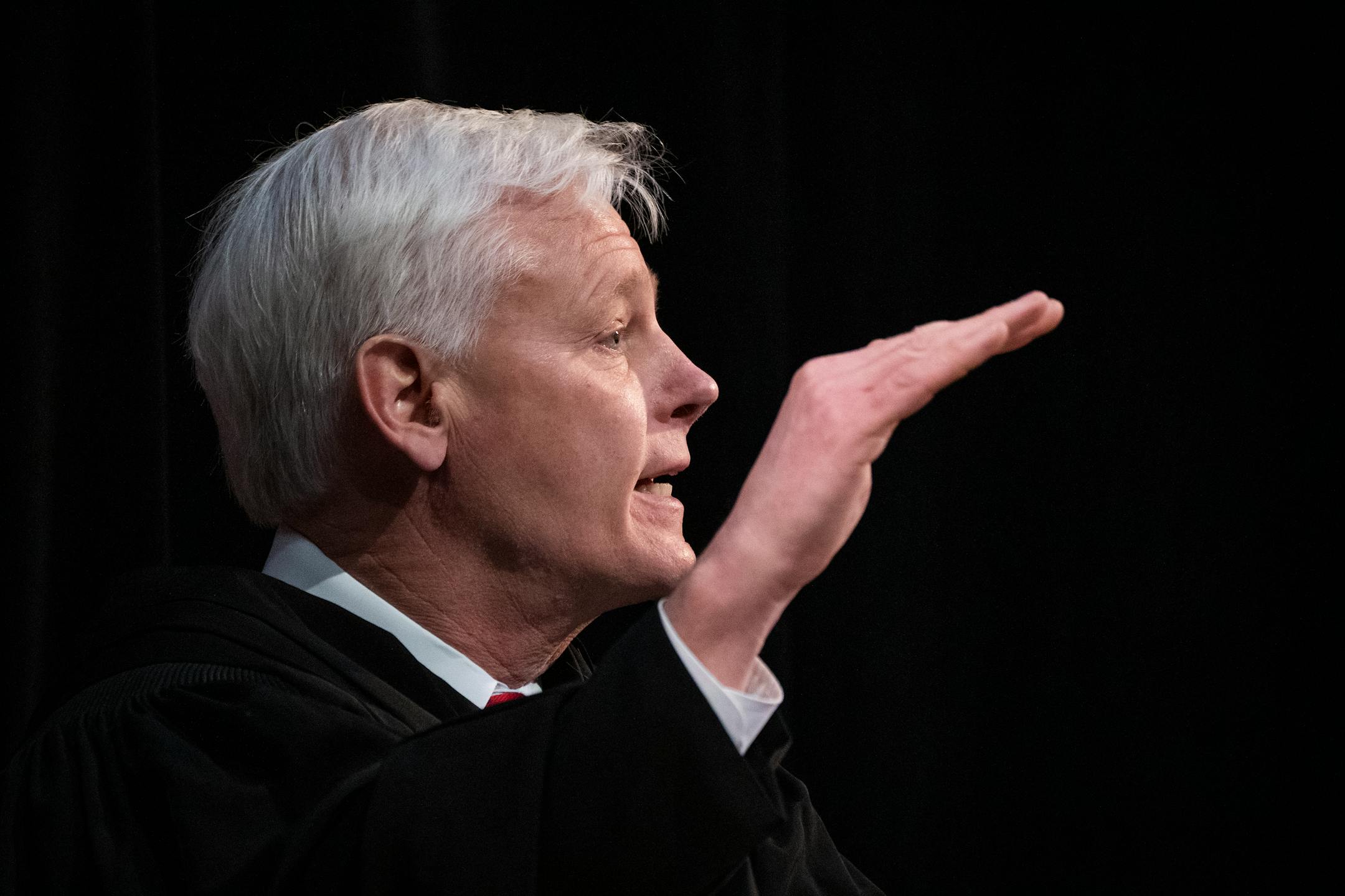 Associate Justice Paul C. Thissen asks questions as the Minnesota Supreme Court hears oral arguments in the case Cruz-Guzman v. State of Minnesota inside the auditorium at Richfield High School.