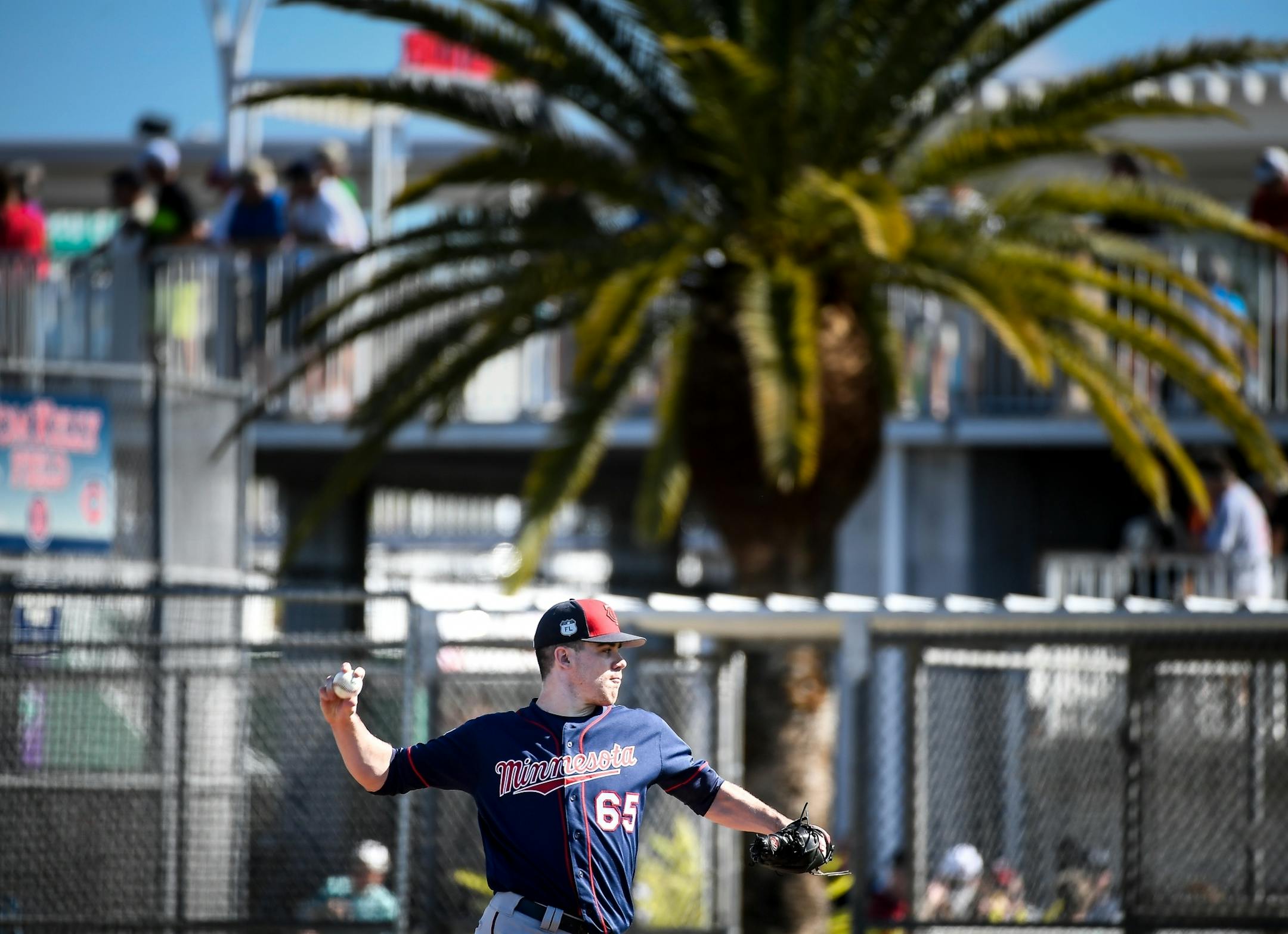 Minnesota Twins relief pitcher Trevor May (65) threw a pitch during infield practice Monday.