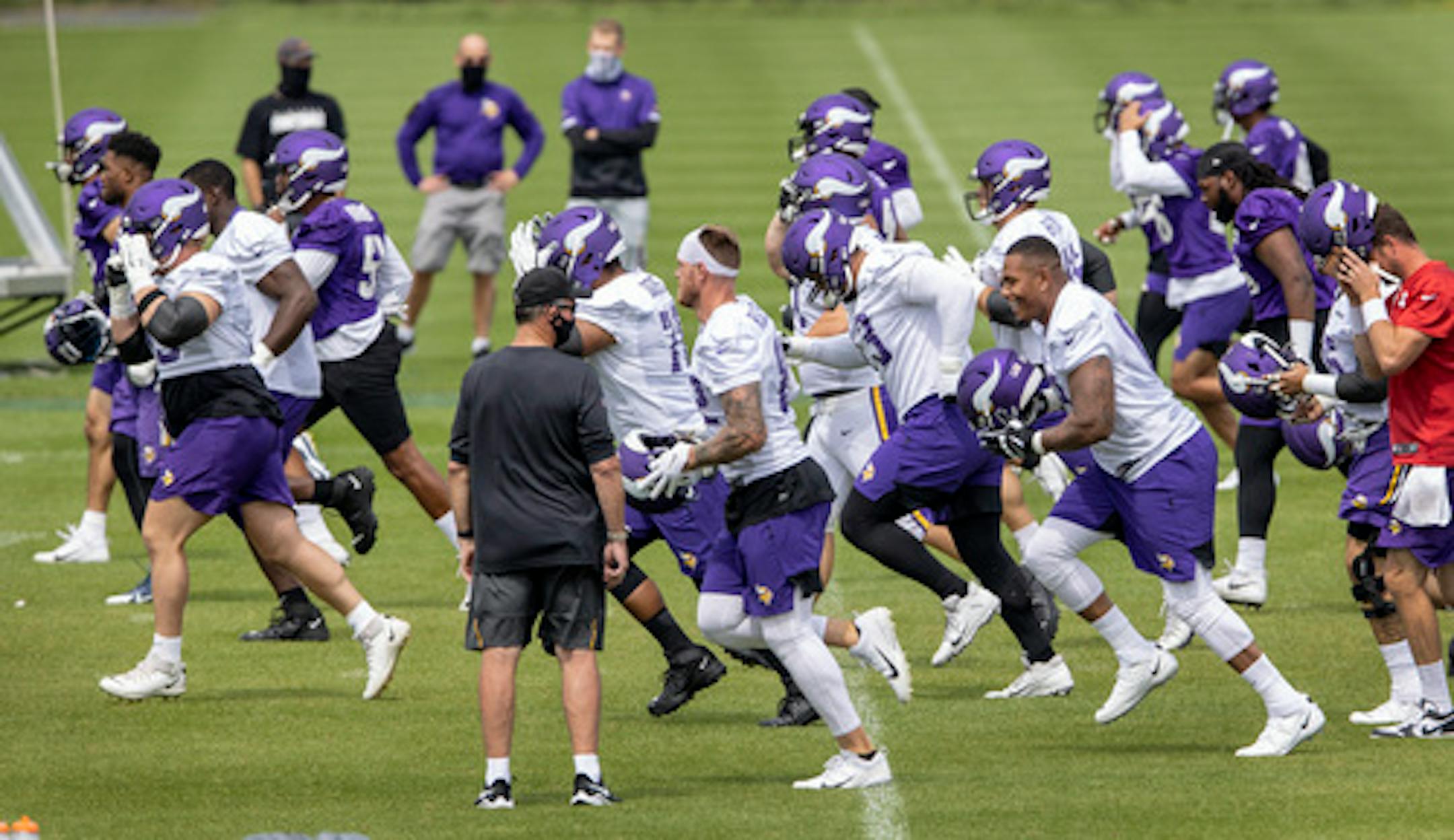 Minnesota Vikings players warmed up during the first day of Training camp.